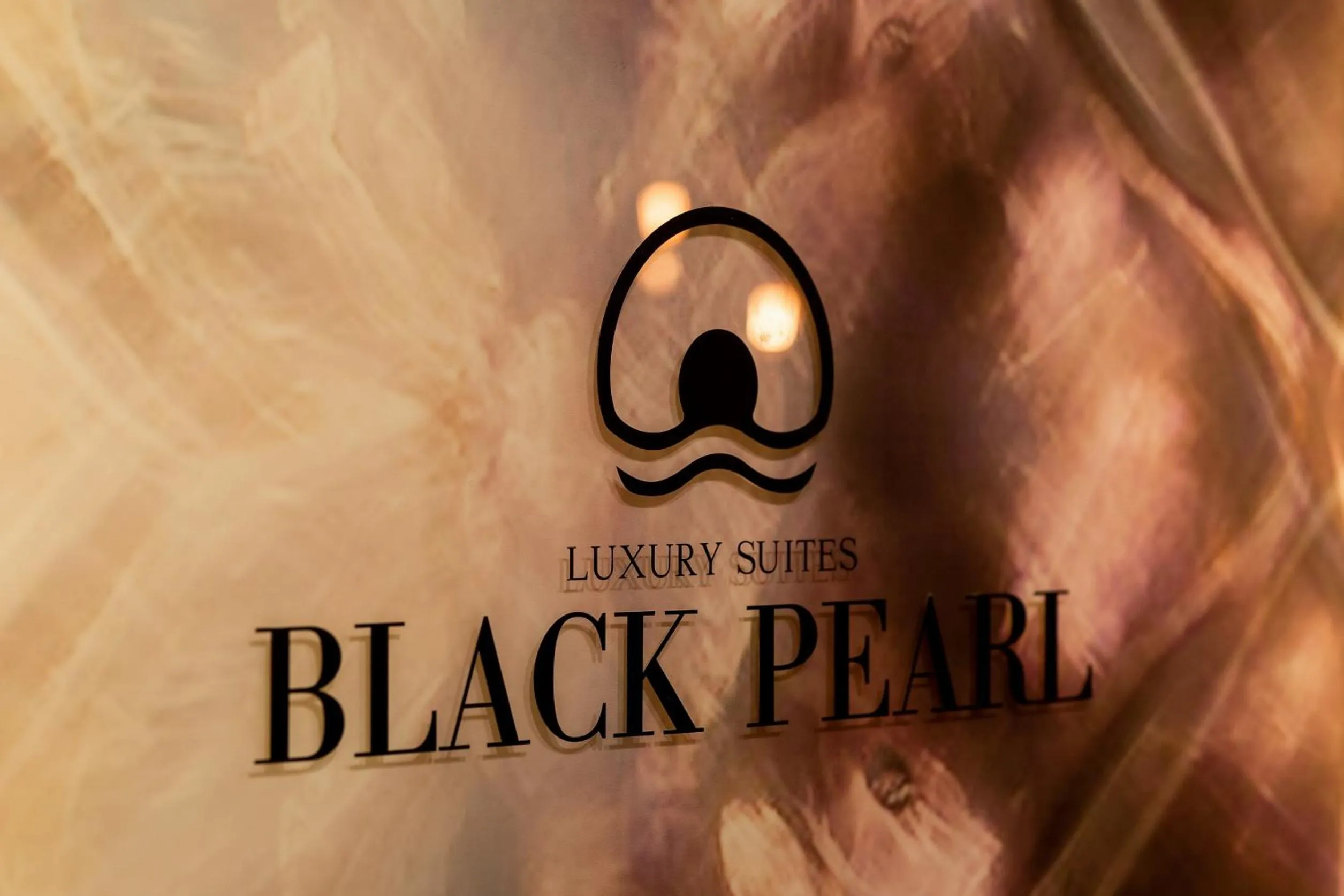 Property logo or sign in Black Pearl Luxury Suites