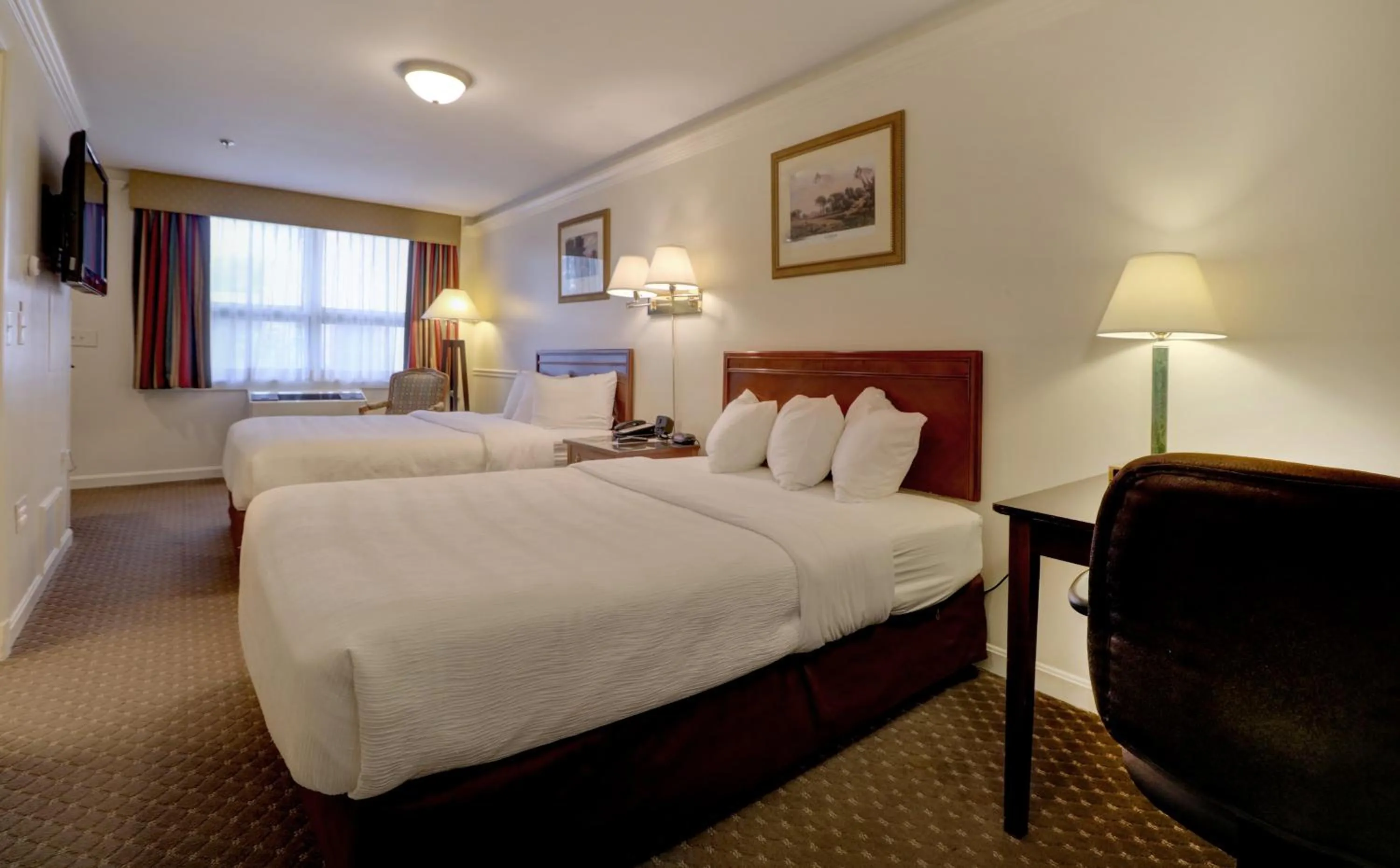 Bed in Senator Inn & Spa