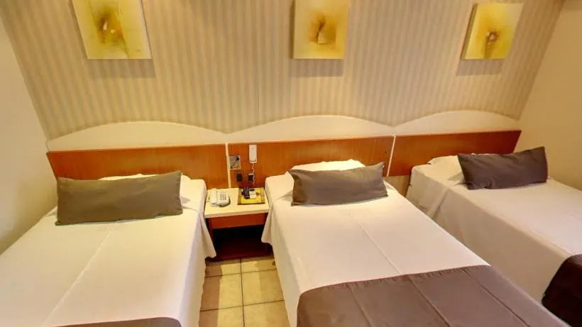 Bed in Pousada dos Girassóis