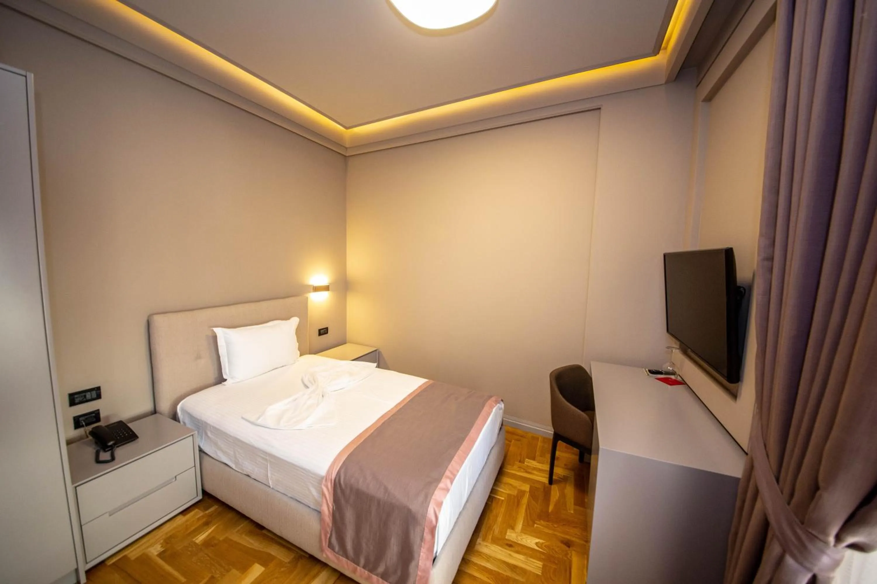 Photo of the whole room, Bed in City Center Hotel