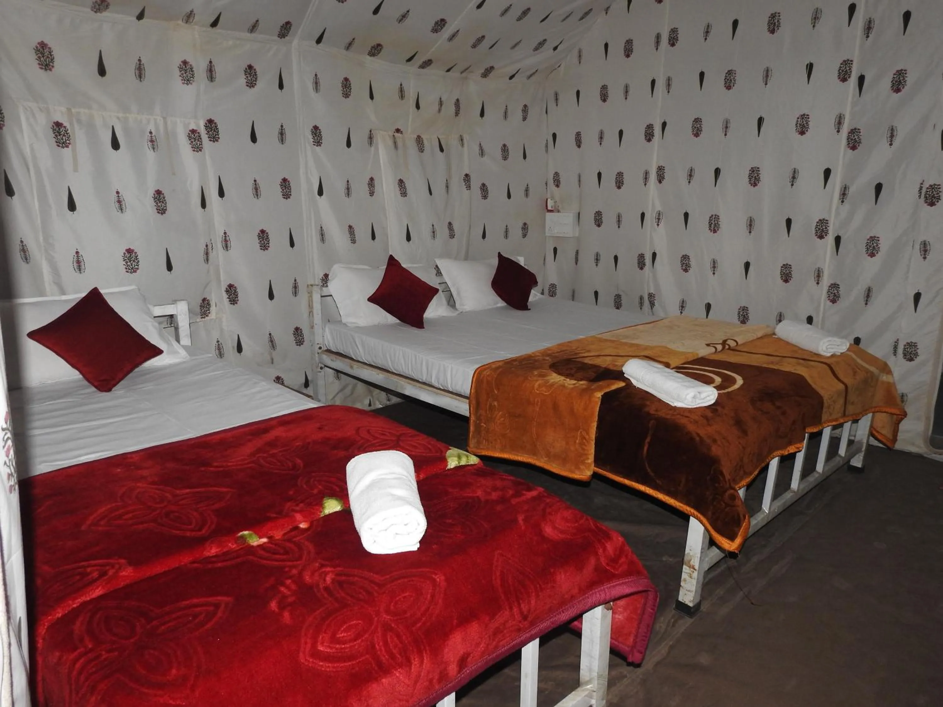 Bed in Kaziranga Eco Camp