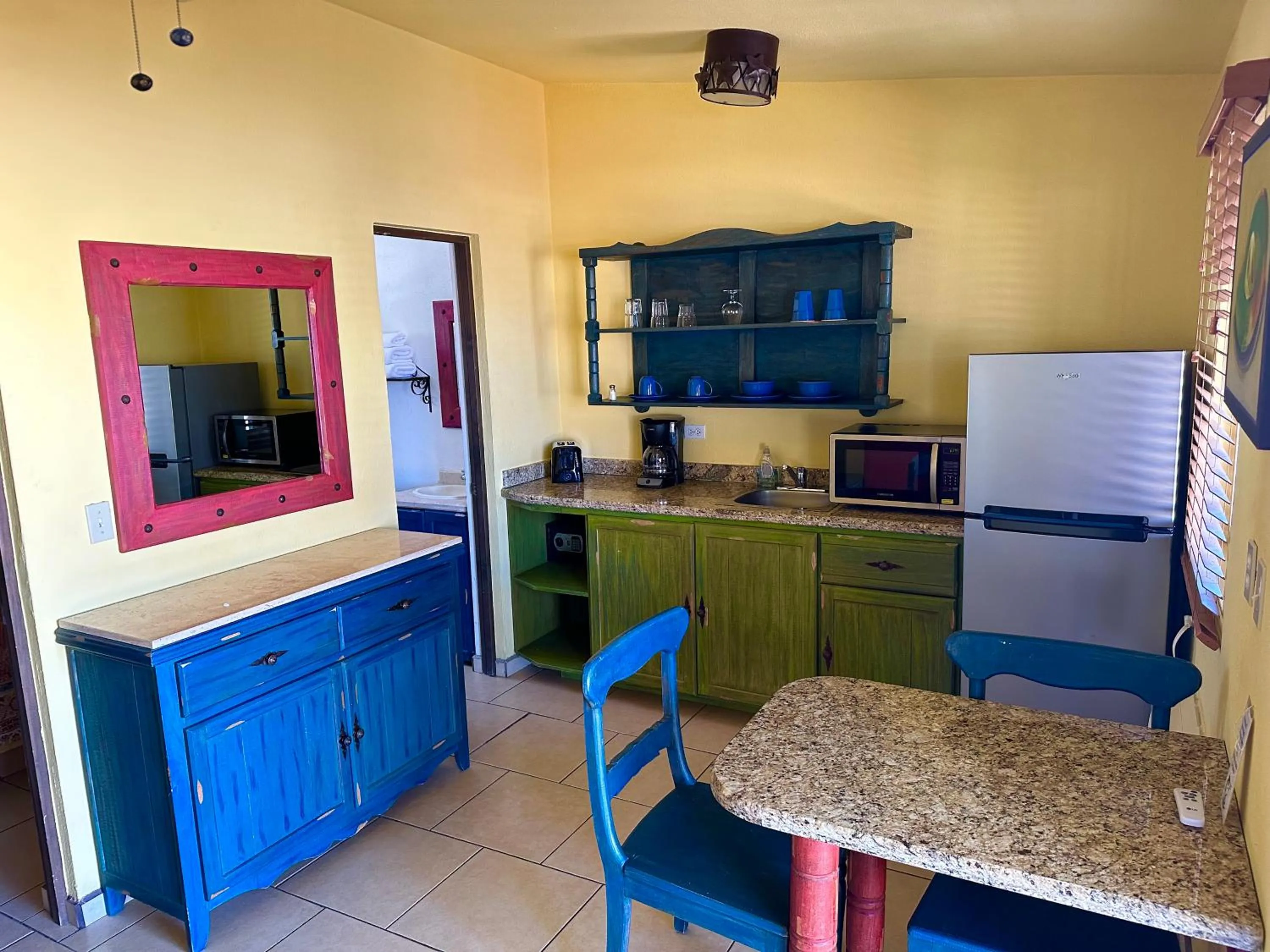 Kitchen or kitchenette in Siesta Suites Boutique Hotel