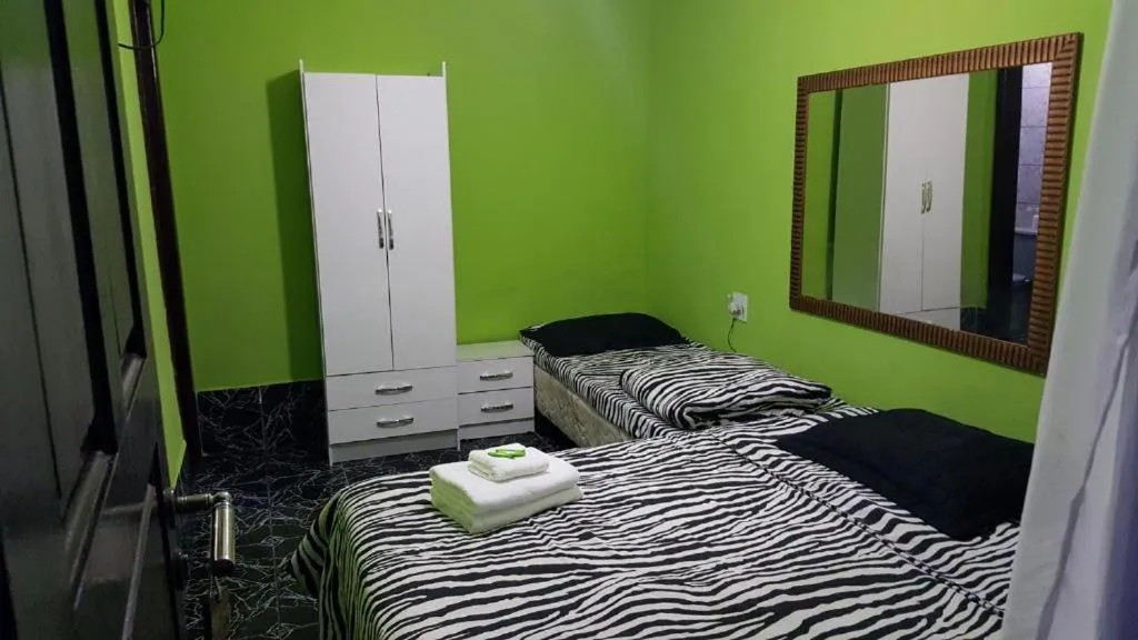 Bed in Pousada Ferradura Beach