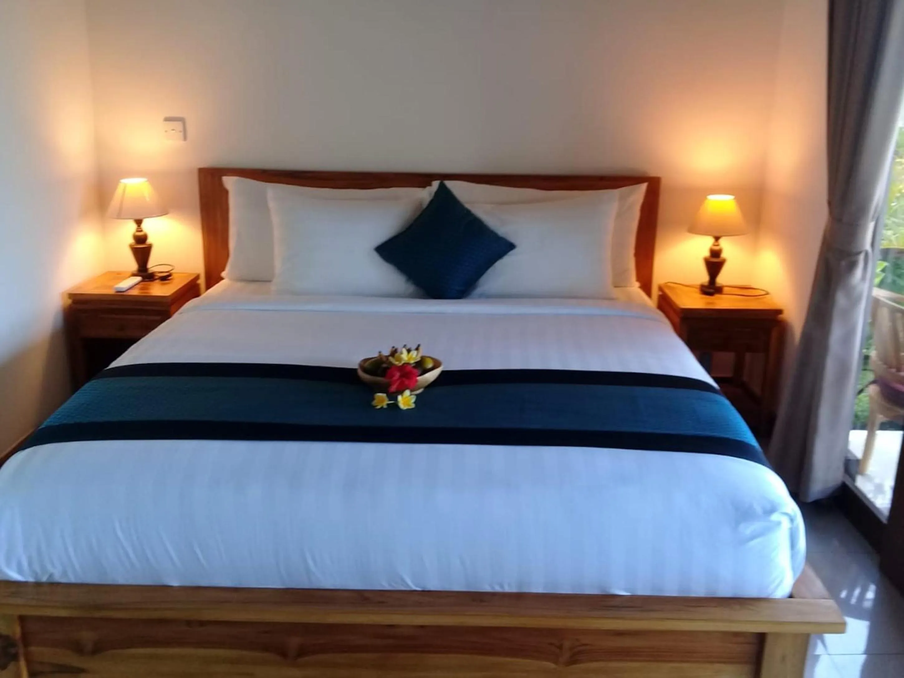 Bed in Paraiso Cottage Ubud