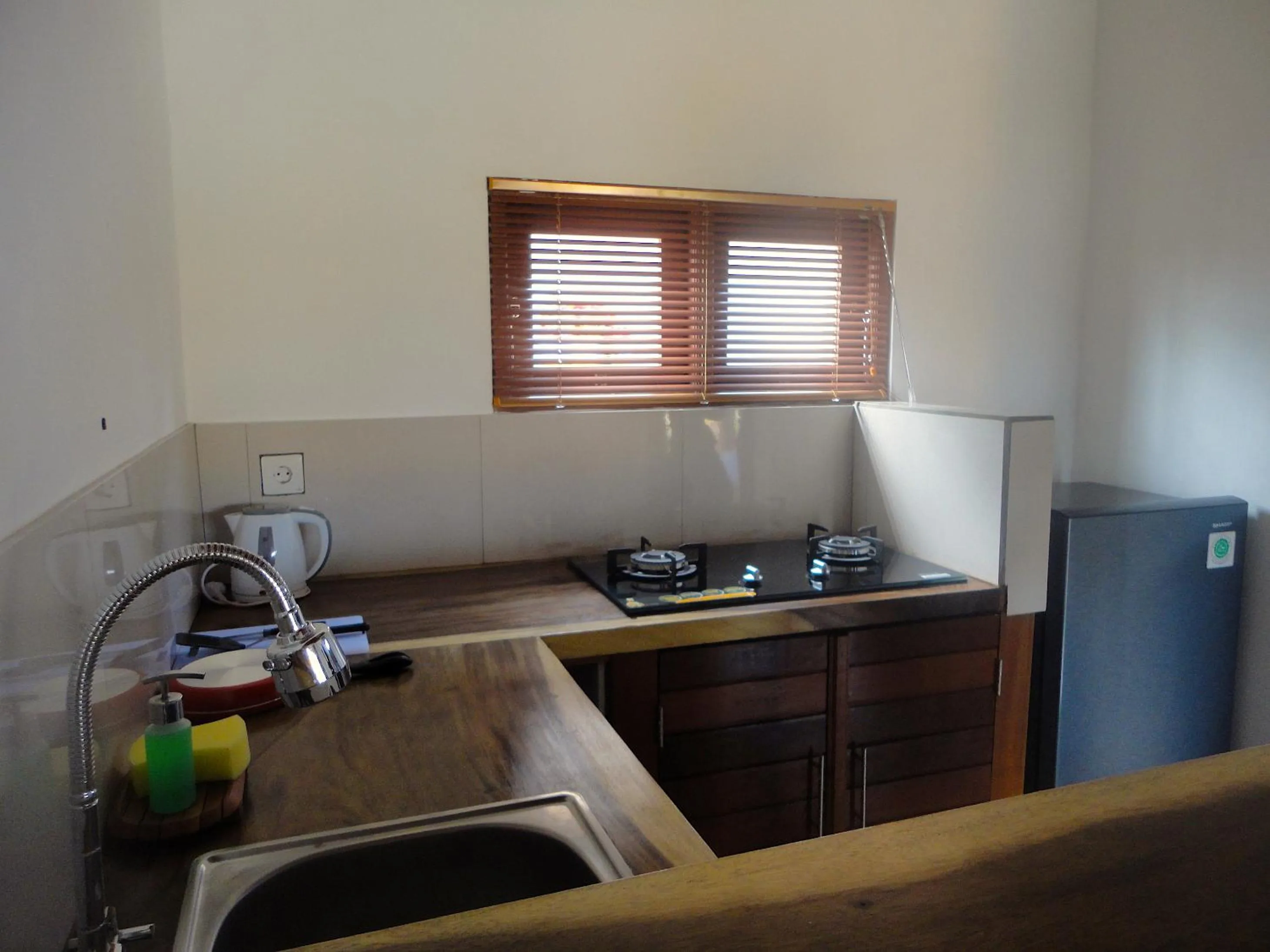 Kitchen or kitchenette in Paraiso Cottage Ubud