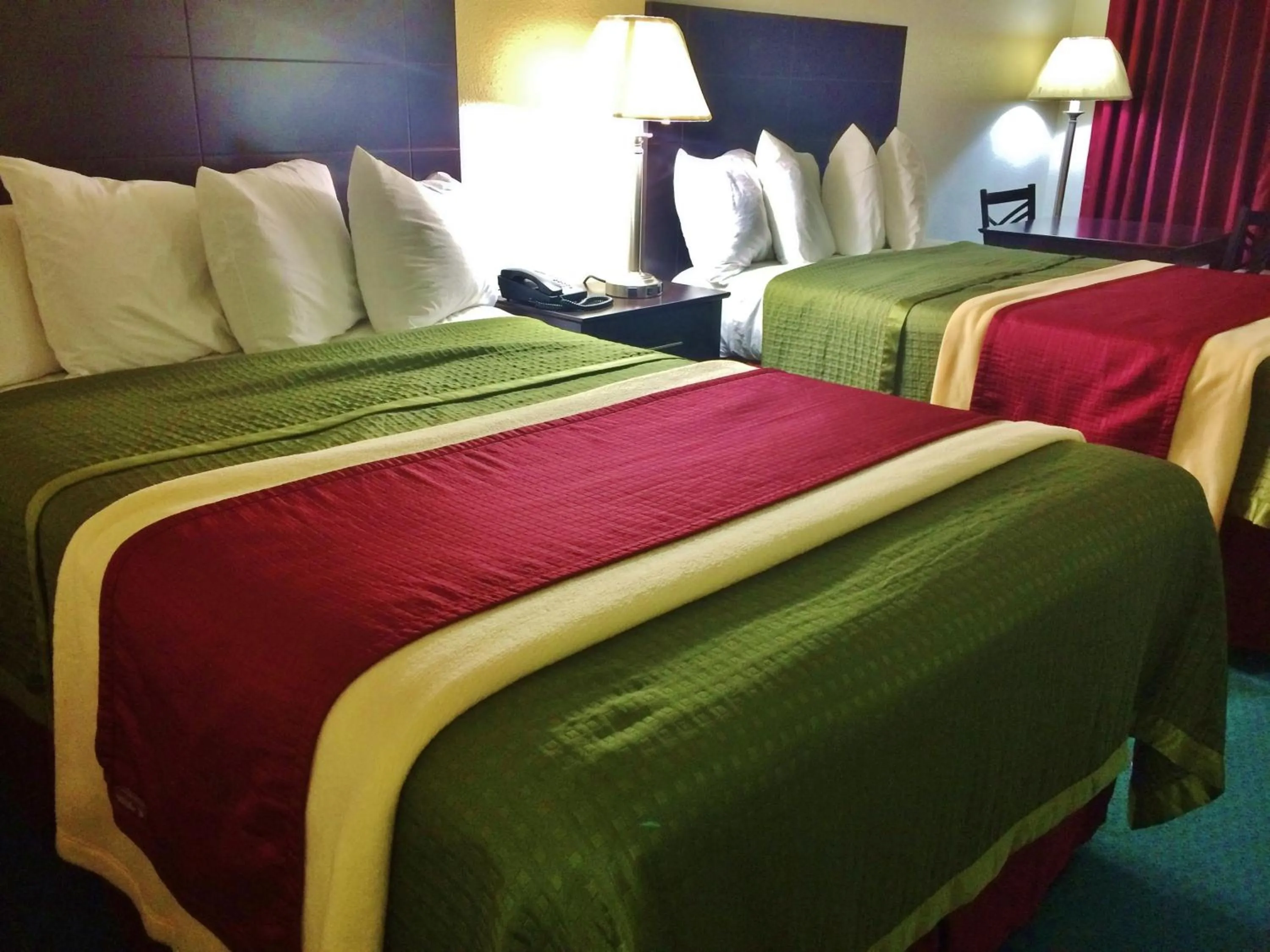 Bed in Travel Inn & Suites