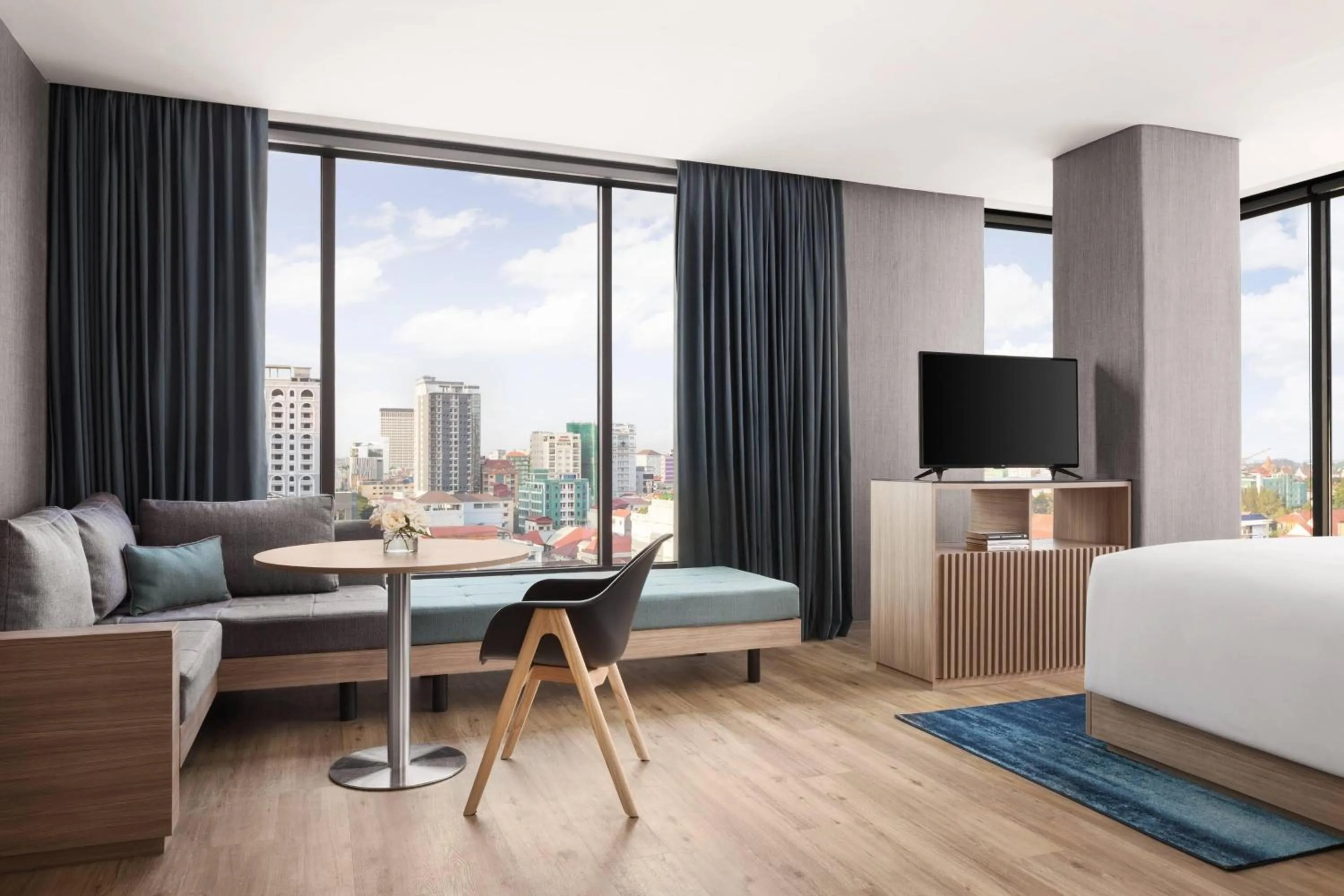 Living room, Bed in Courtyard by Marriott Phnom Penh