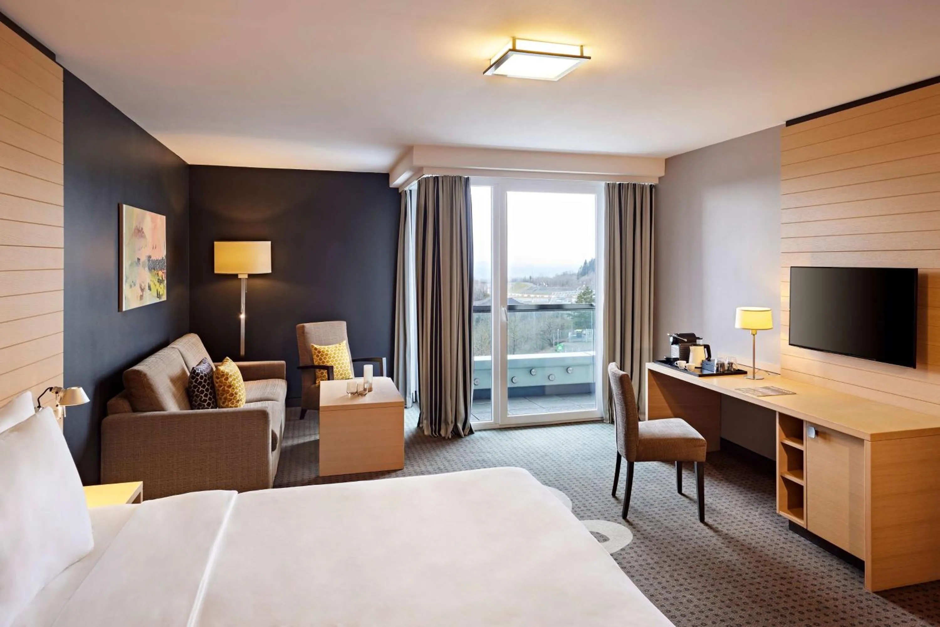 Photo of the whole room, Bed in Nürburgring Congress Hotel