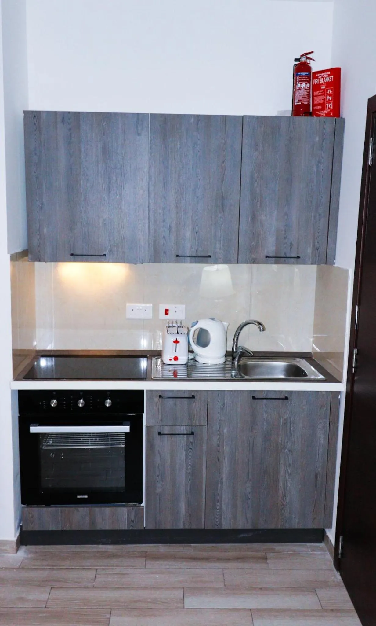 Kitchen or kitchenette in Napoli Suites Studios Aparthotel