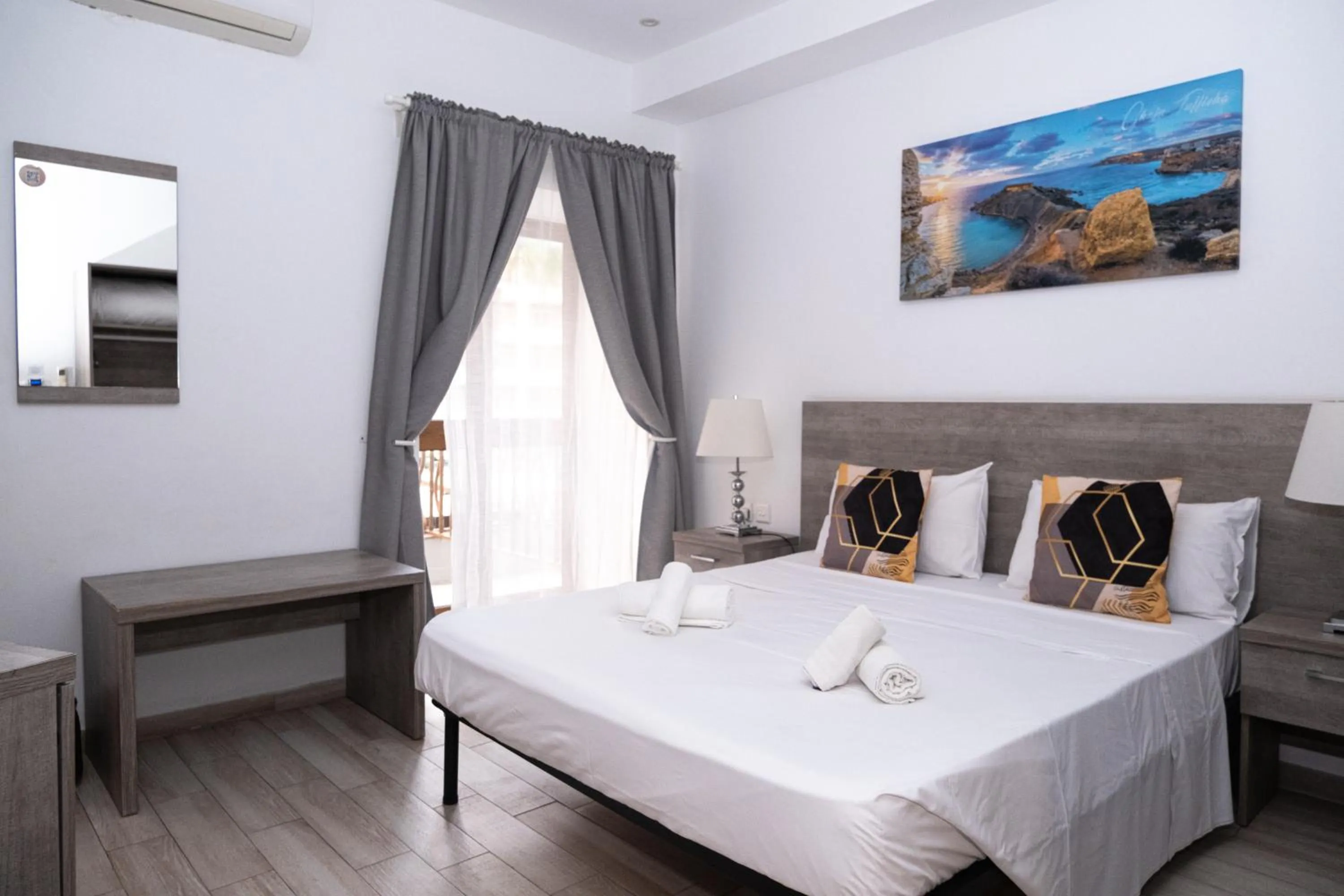 Bed in Napoli Suites Studios Aparthotel