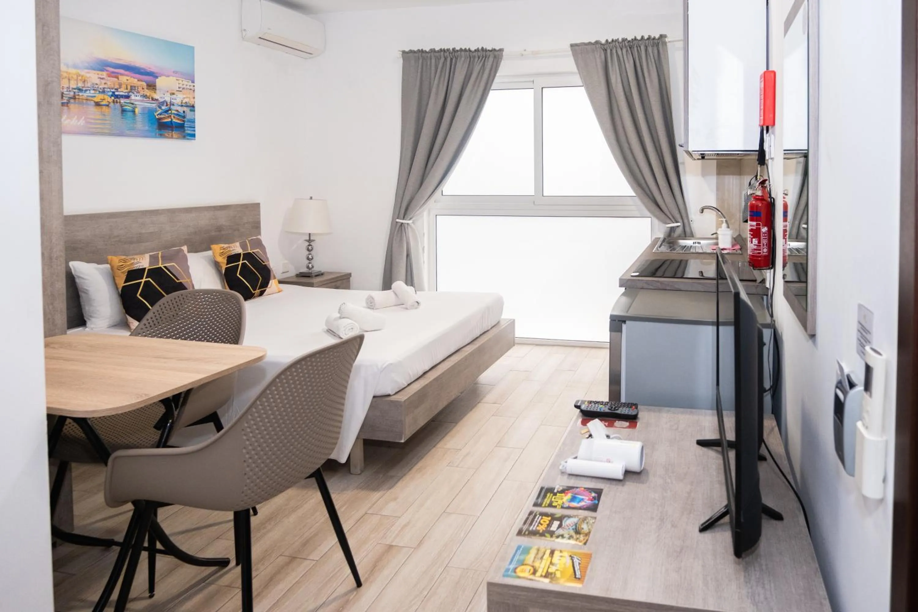 Bed in Napoli Suites Studios Aparthotel