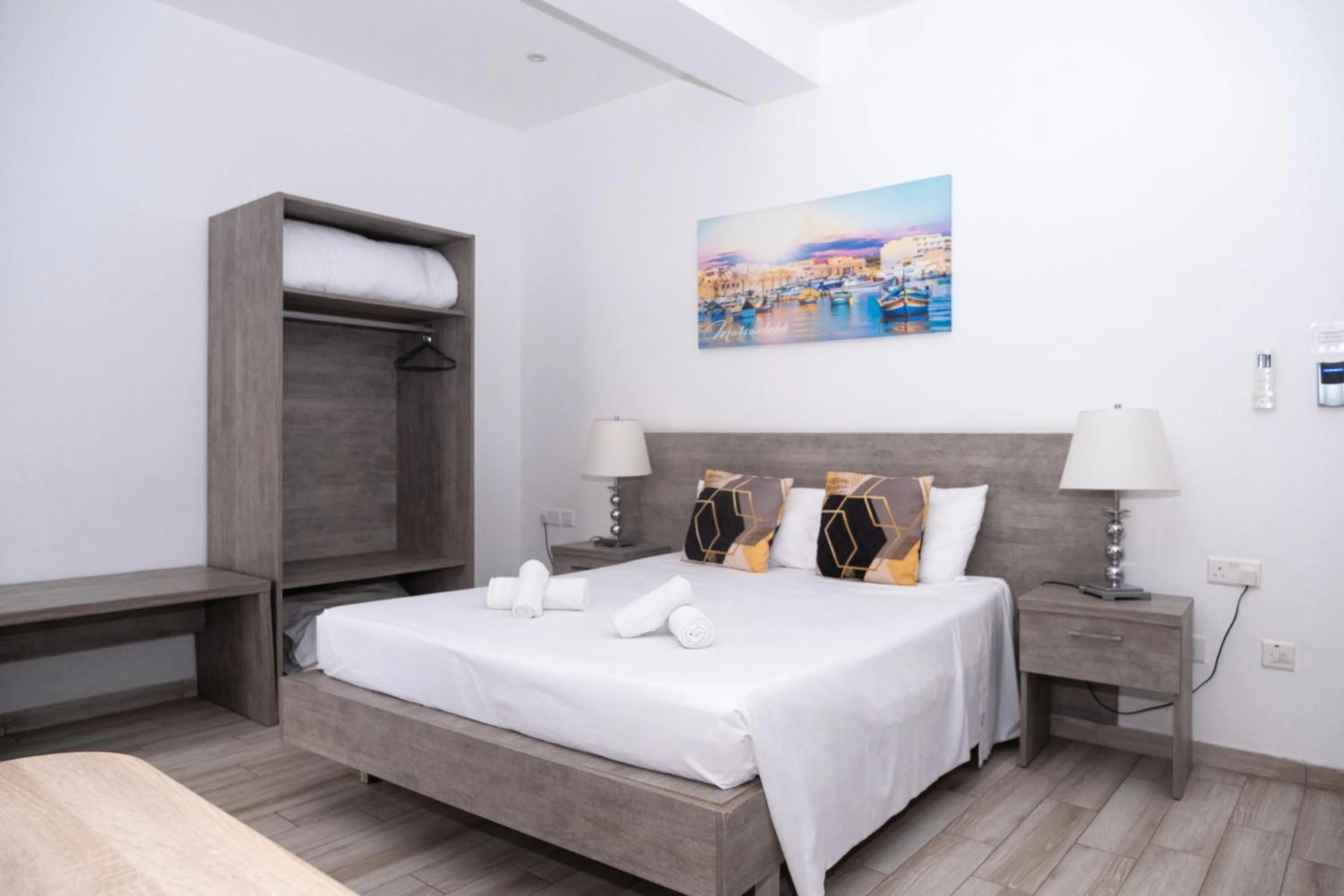 Bed in Napoli Suites Studios Aparthotel