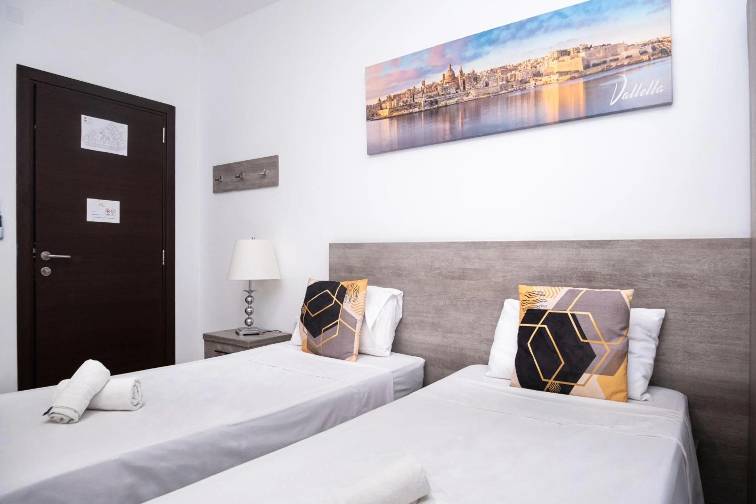 Bed in Napoli Suites Studios Aparthotel