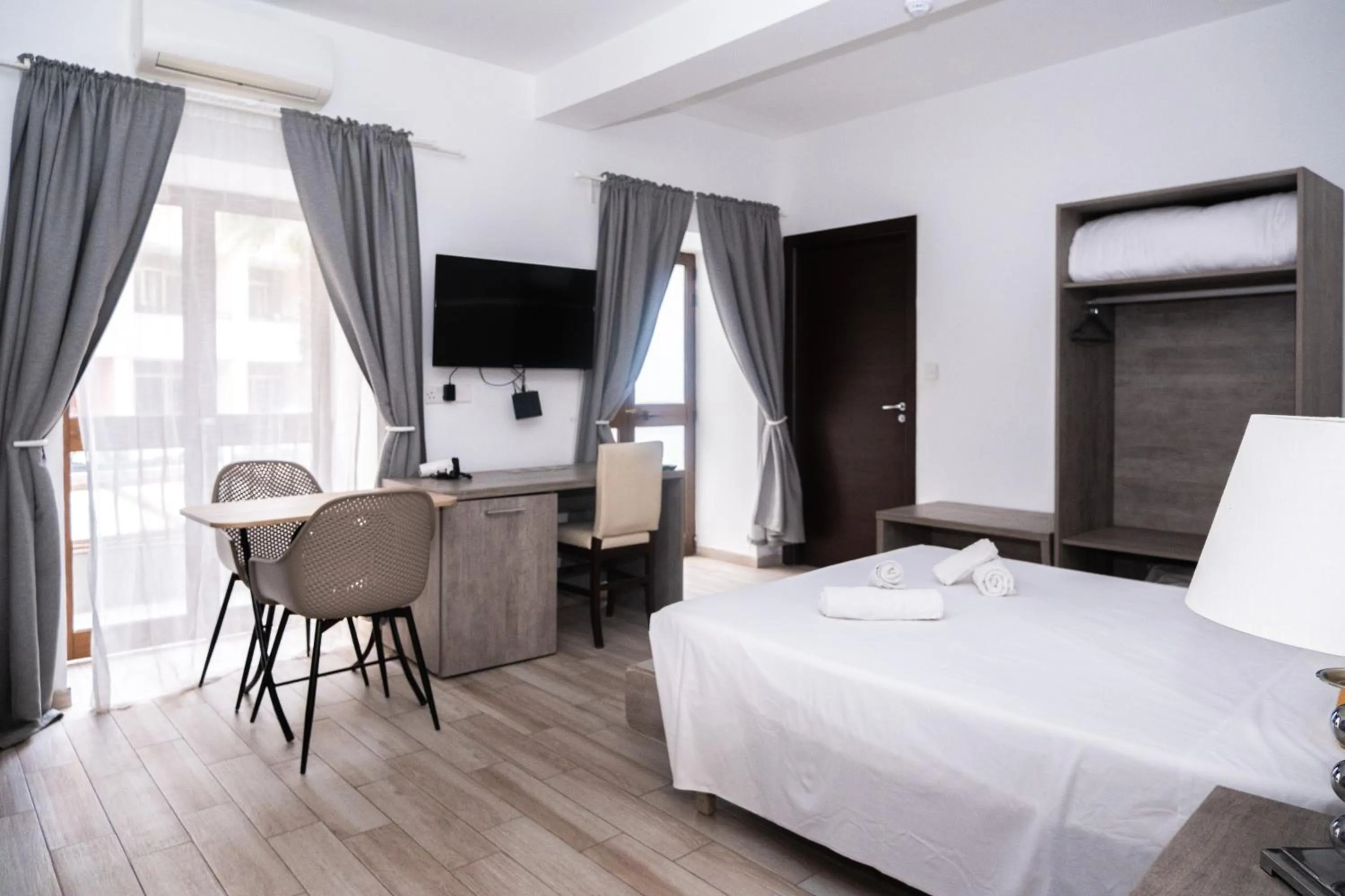 Bed in Napoli Suites Studios Aparthotel