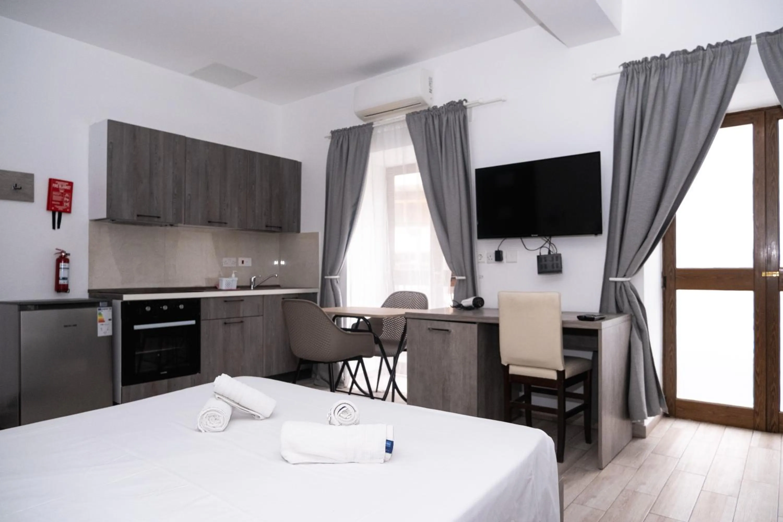 Bed in Napoli Suites Studios Aparthotel