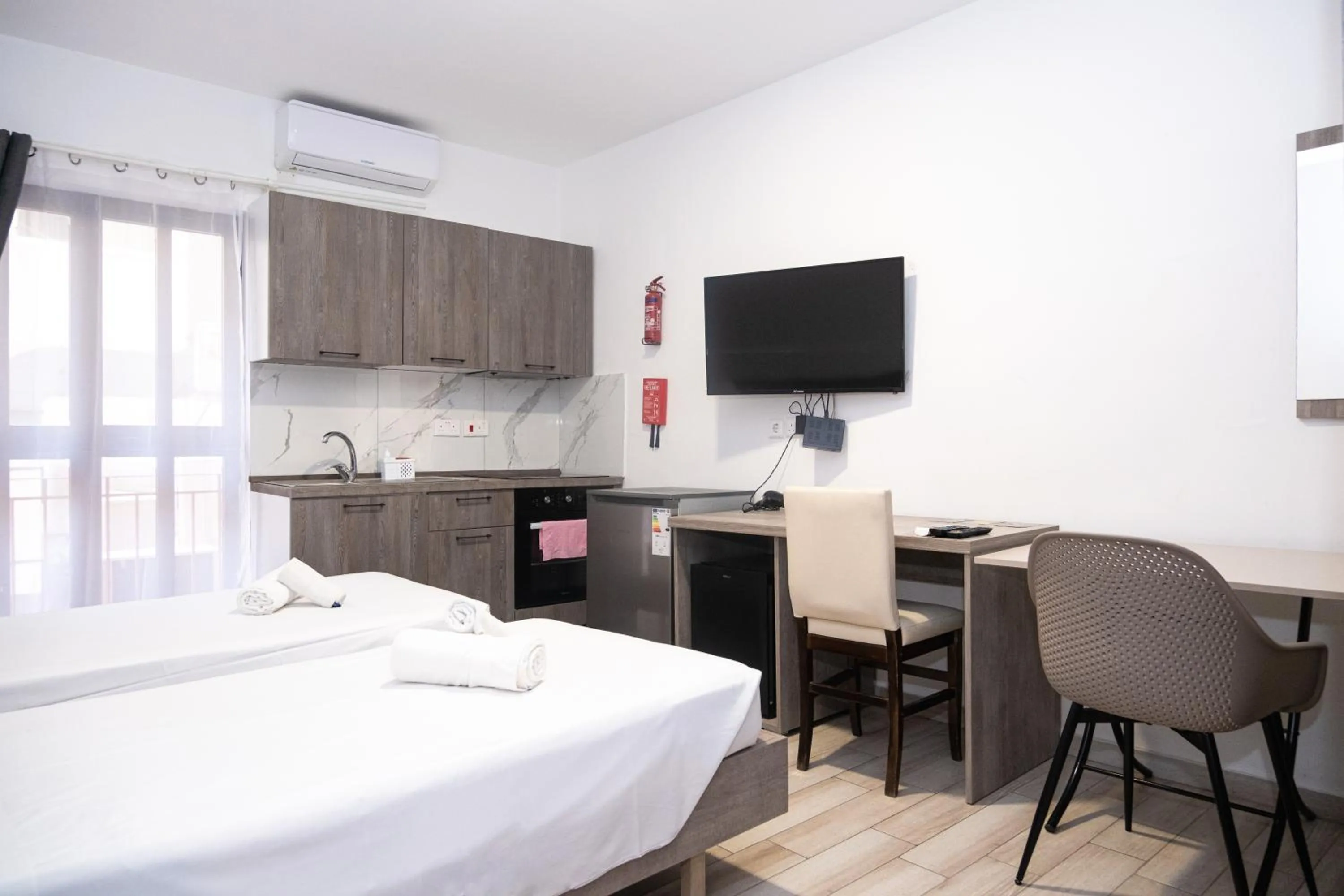 Bed in Napoli Suites Studios Aparthotel