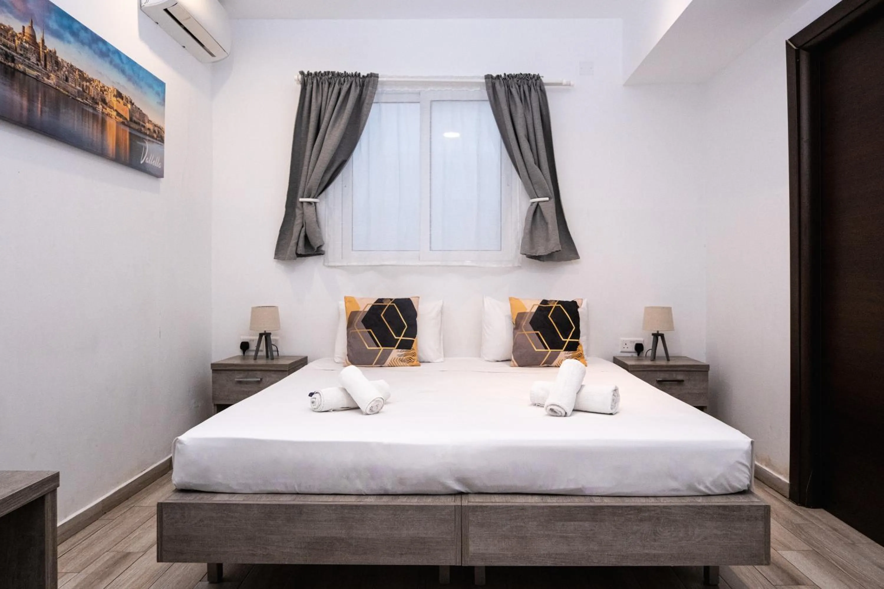 Bed in Napoli Suites Studios Aparthotel