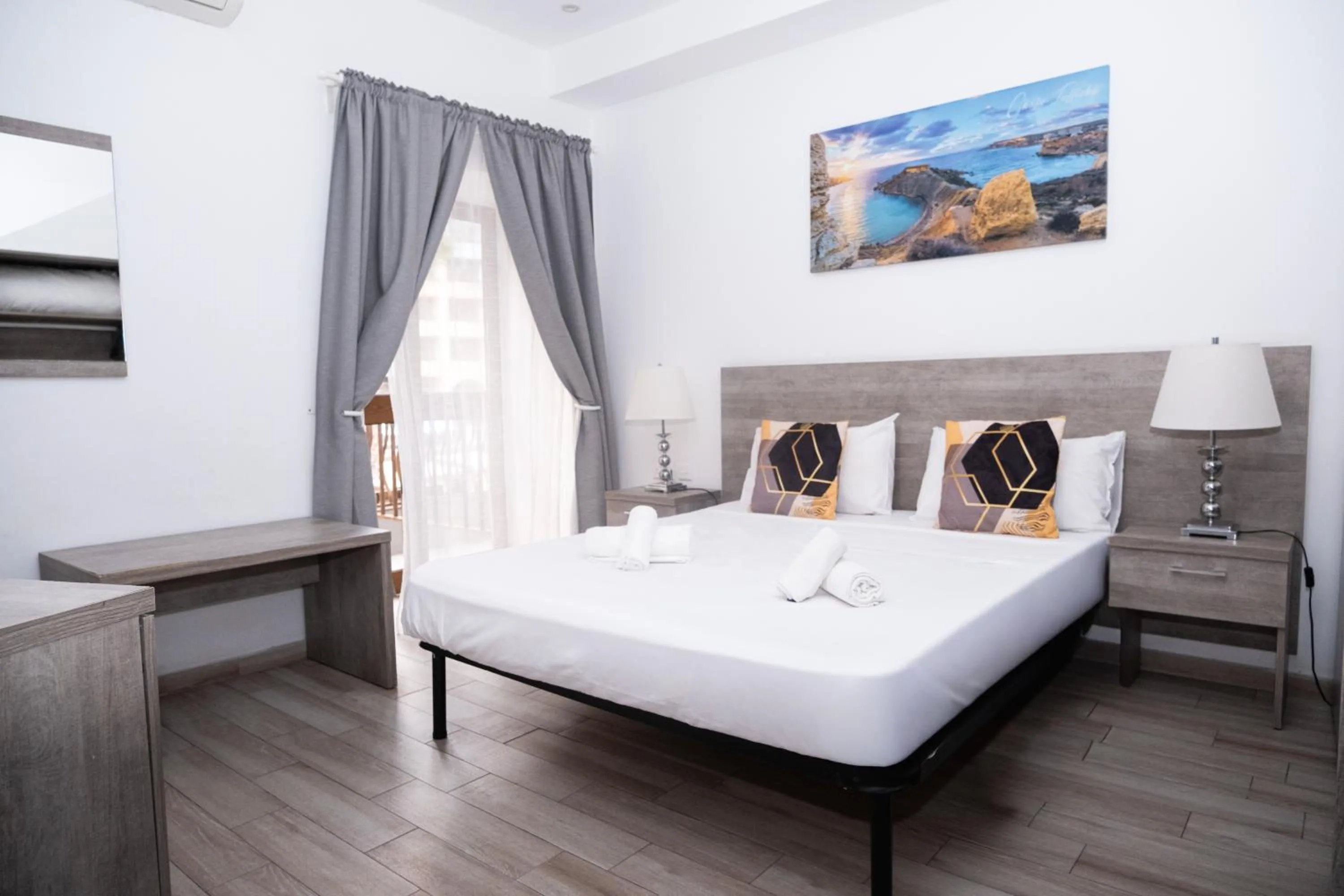 Bed in Napoli Suites Studios Aparthotel