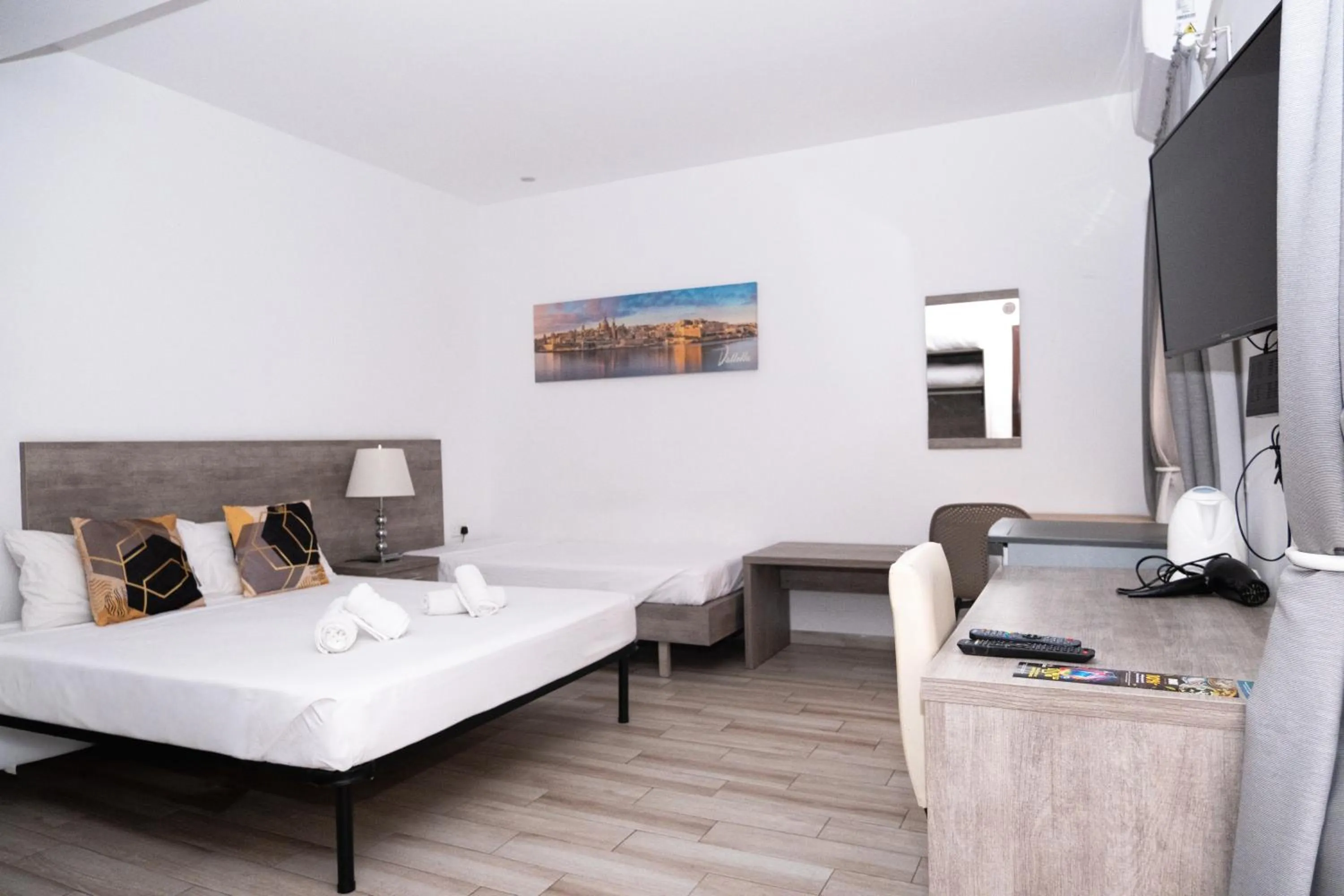 Bed in Napoli Suites Studios Aparthotel