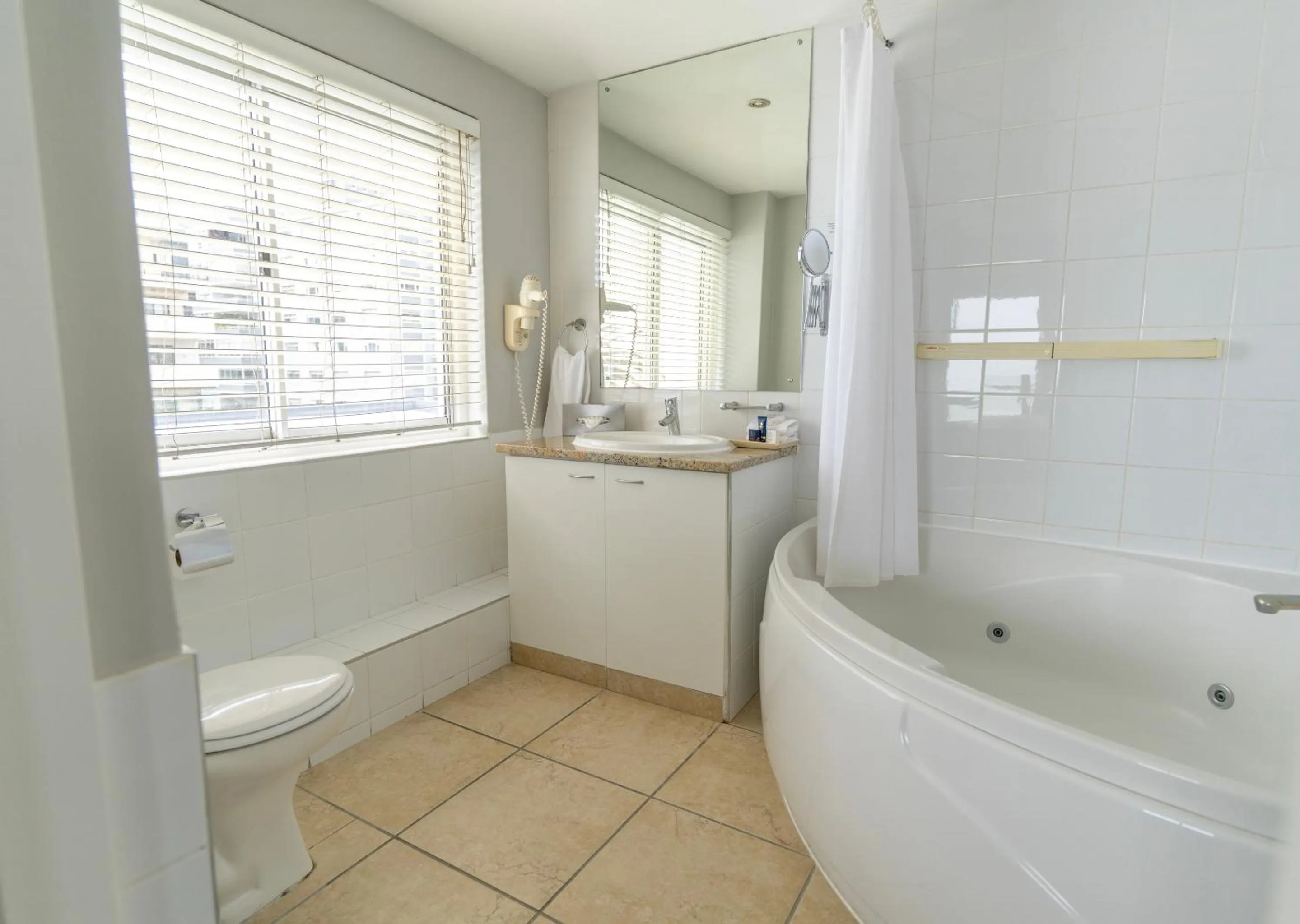 Shower in Peninsula All Suite Hotel by Dream Resorts