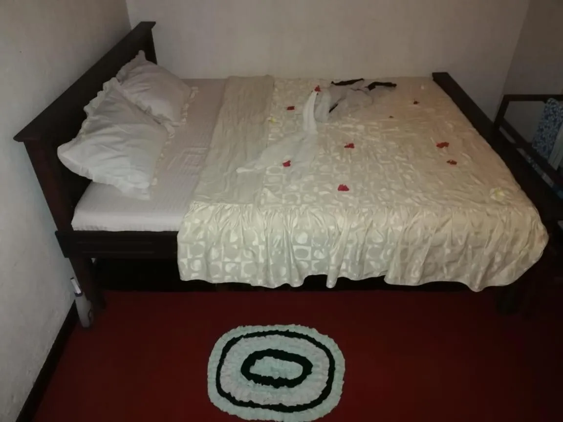 Bed in Triple One Villa