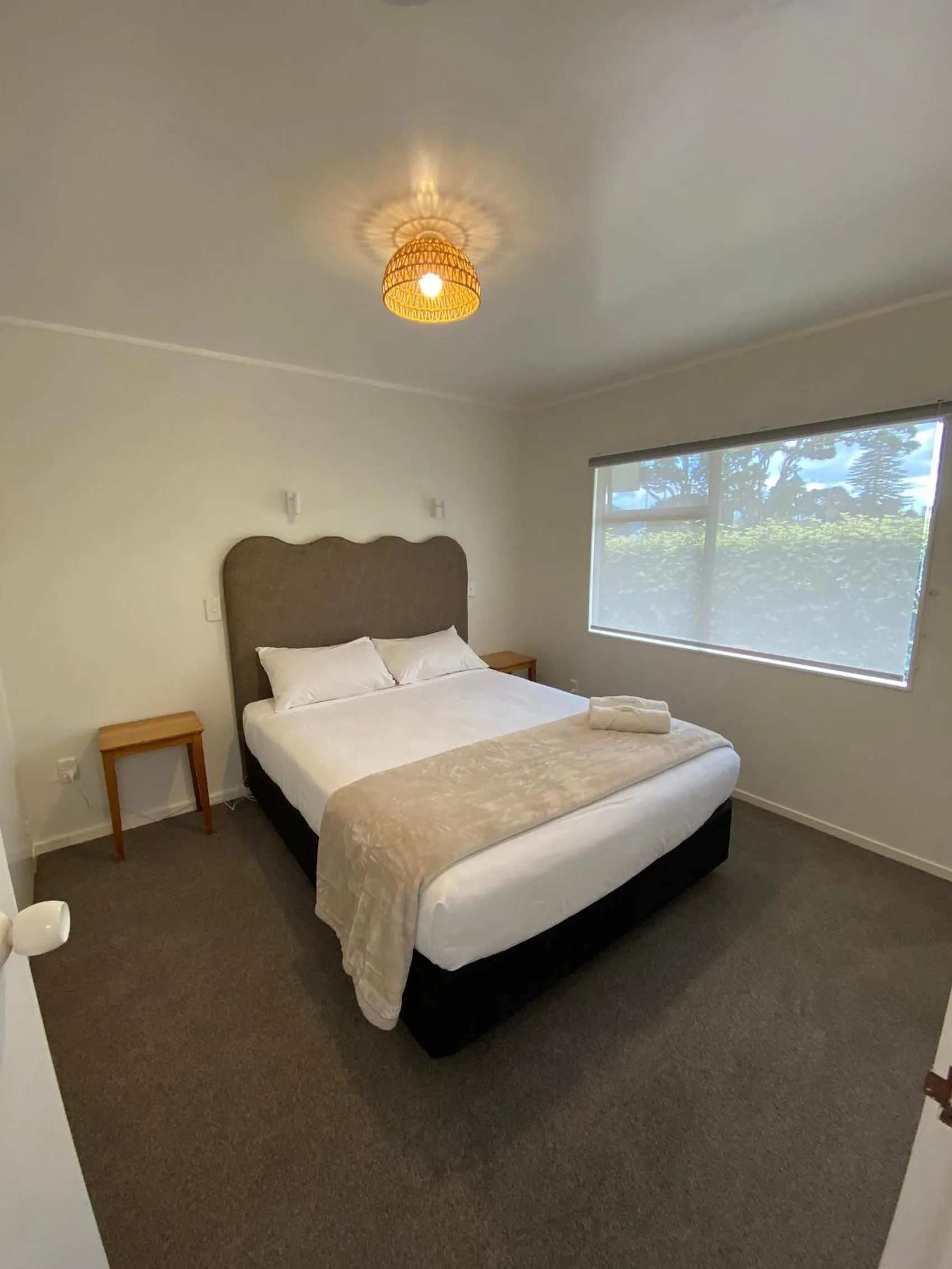 Bed in Opononi Lighthouse Motel