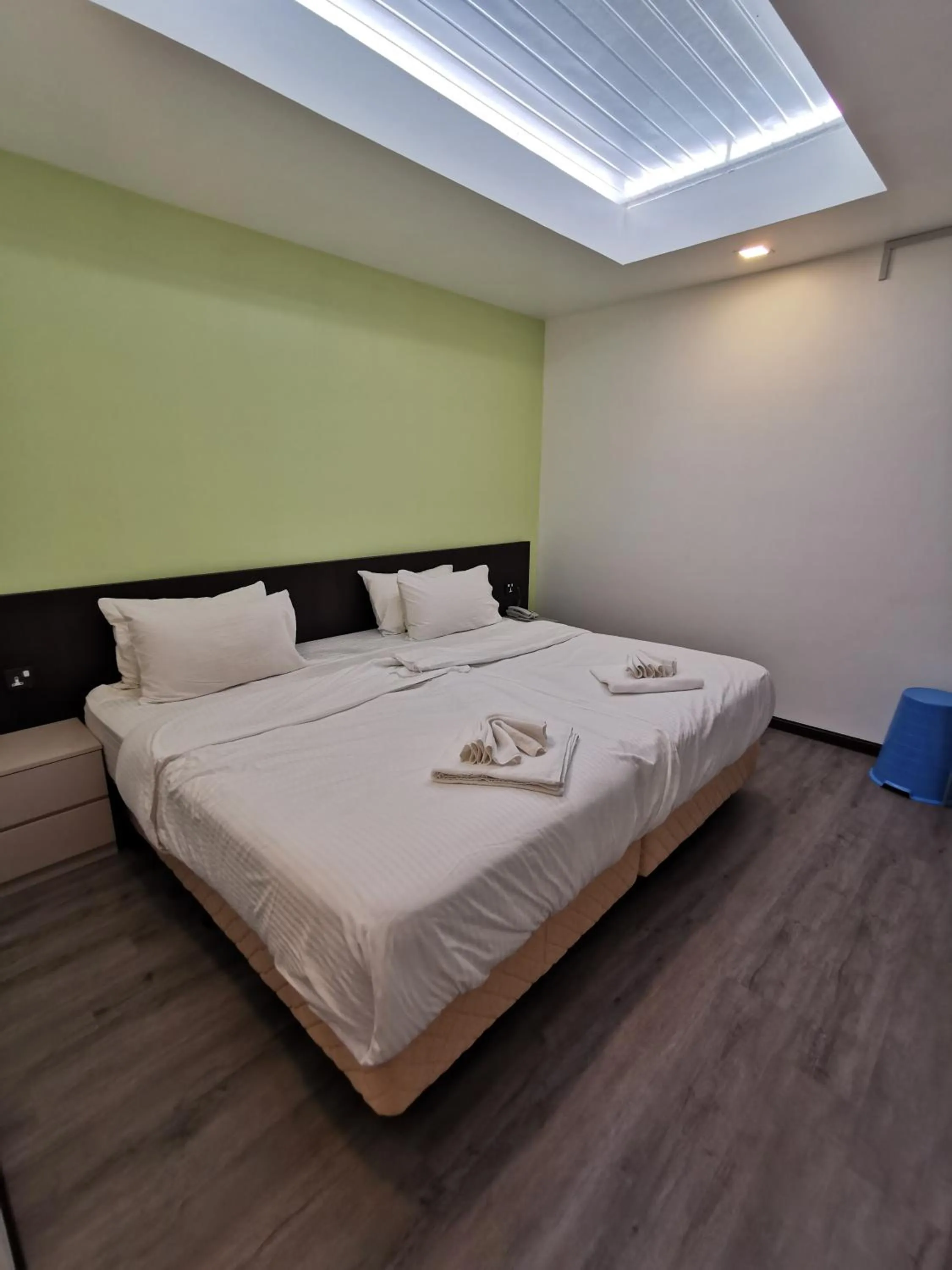 Bed in TT Dorf Hotel Matang