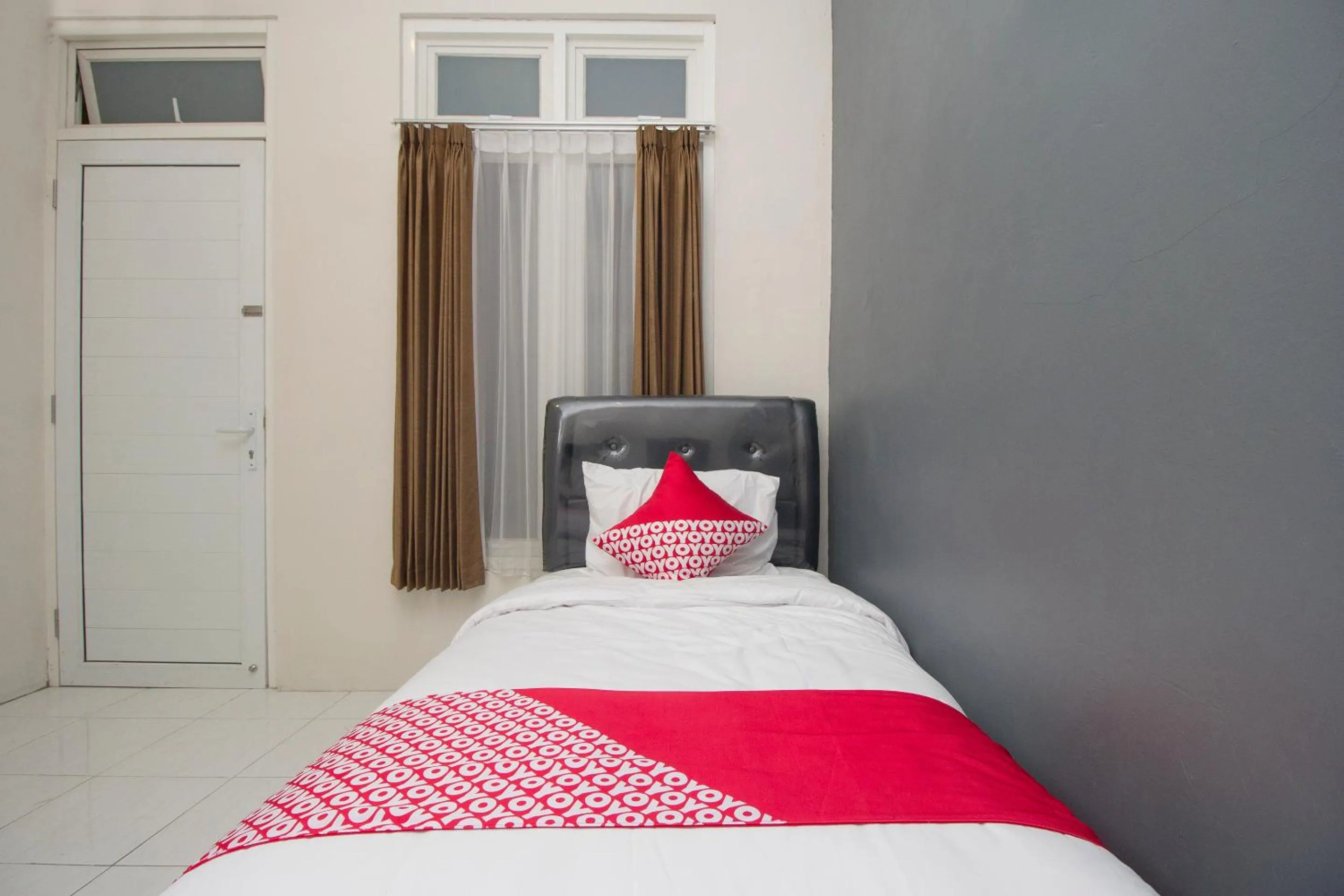 Bed in OYO 647 Irooms Homestay