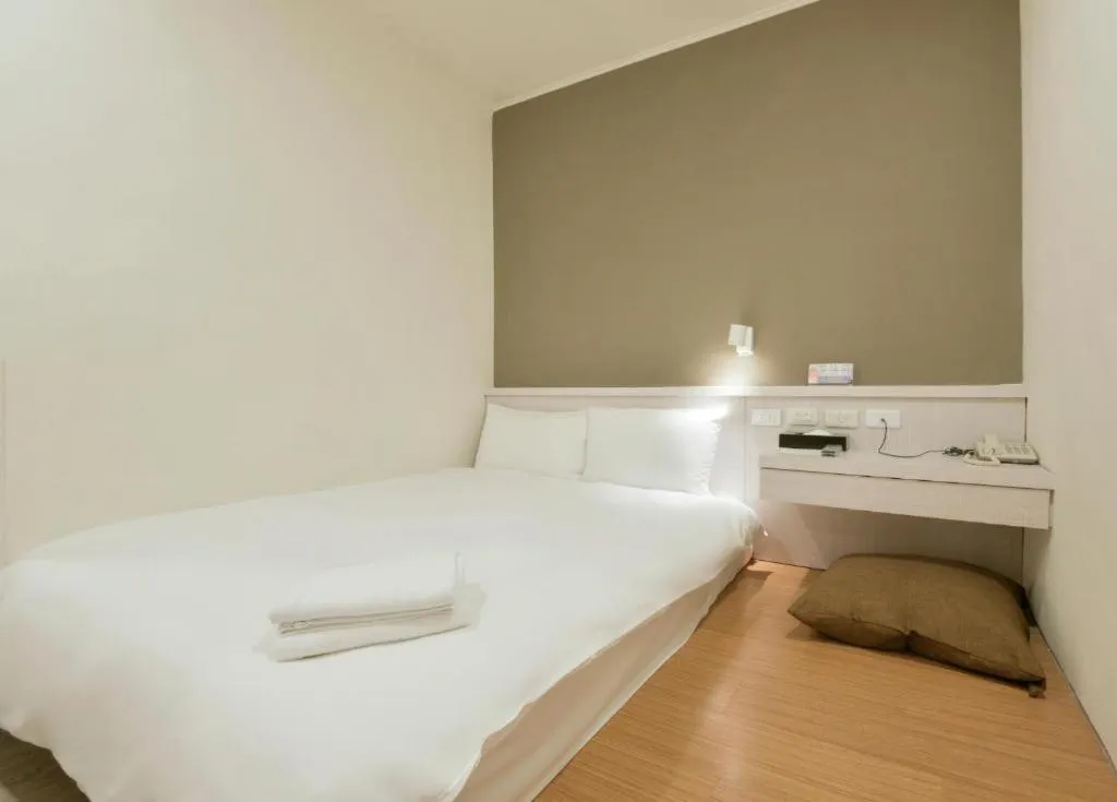Bed in Raise Hotel Taichung