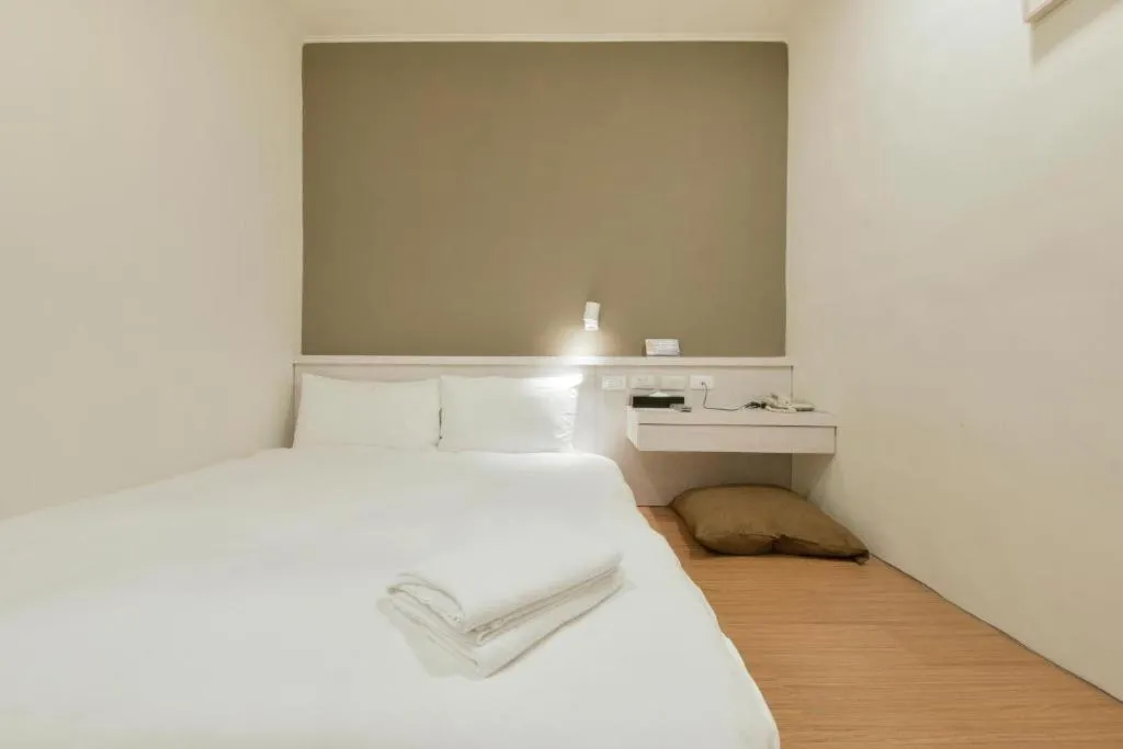 Bed in Raise Hotel Taichung