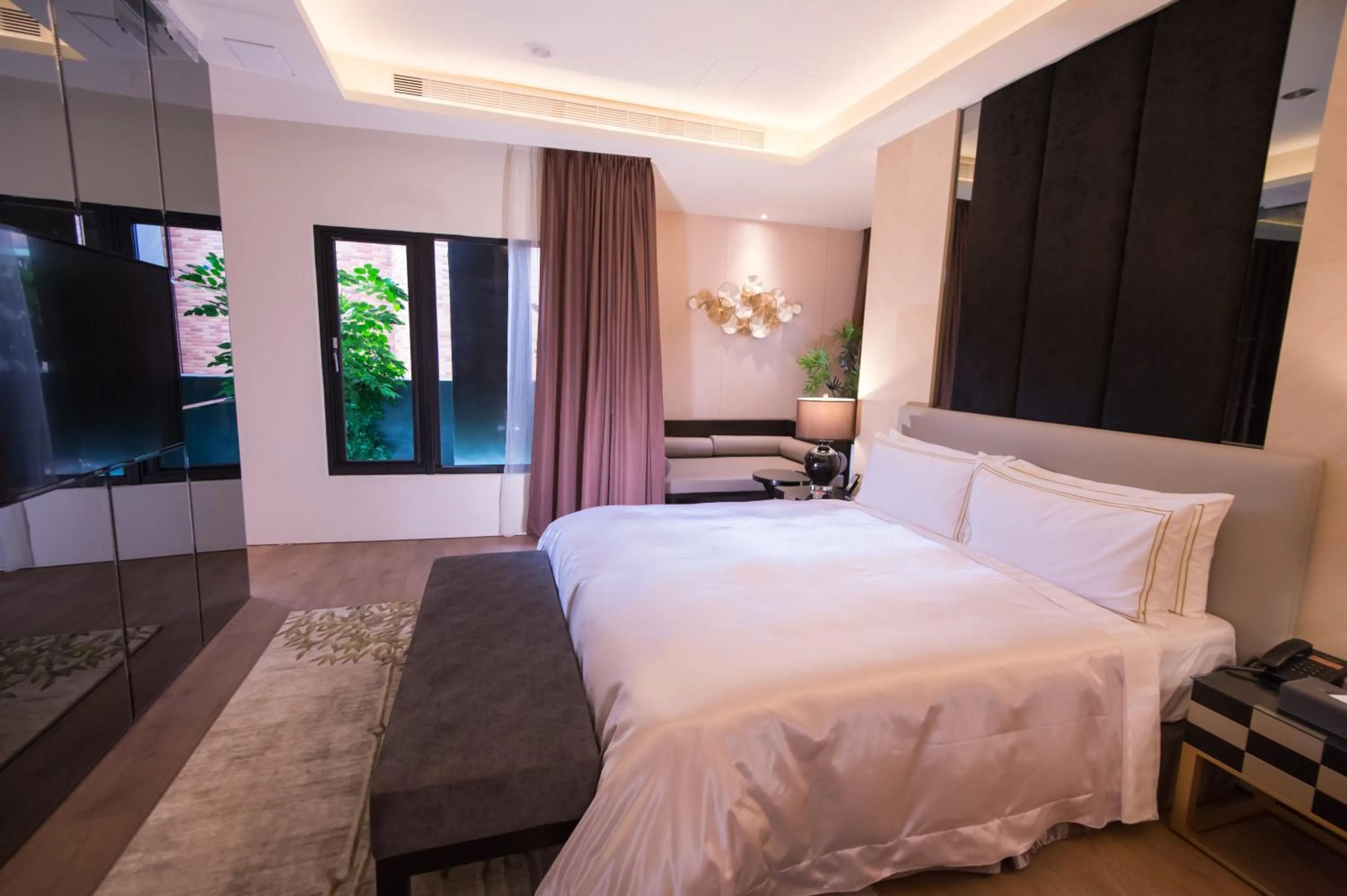 Bed in J Moon Villa Motel