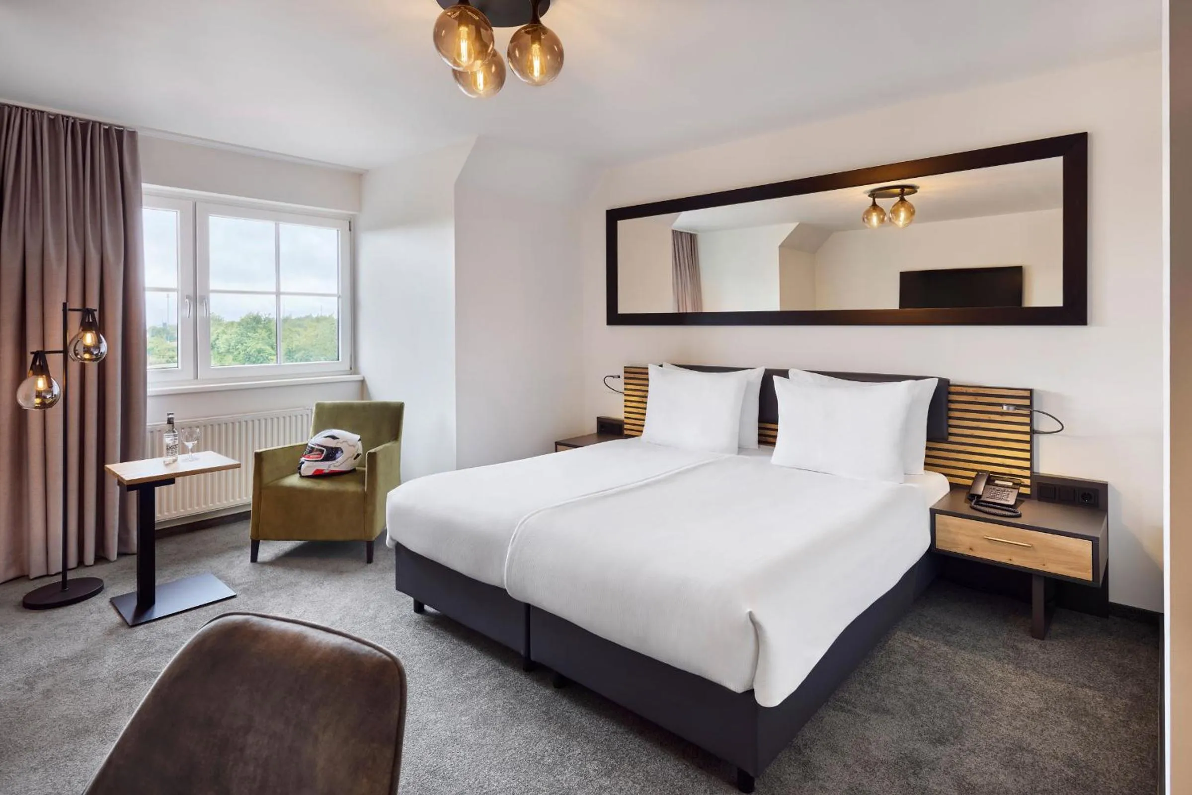 Photo of the whole room, Bed in Nürburgring Motorsport Hotel