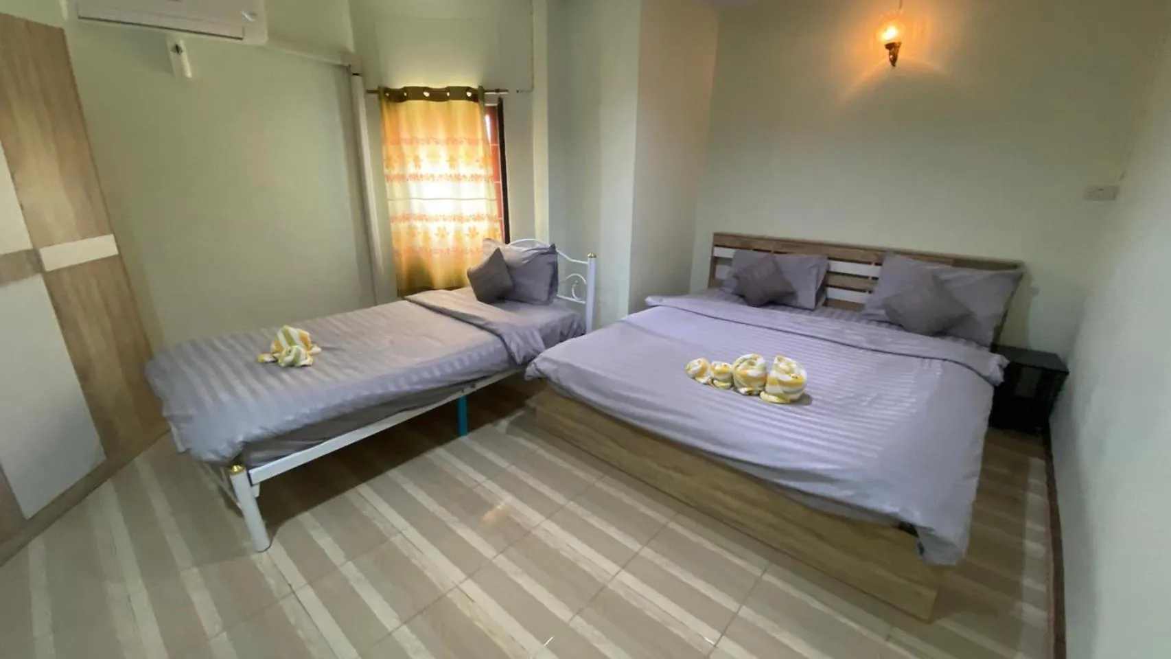 Bed in Alongkorn hotel by SB