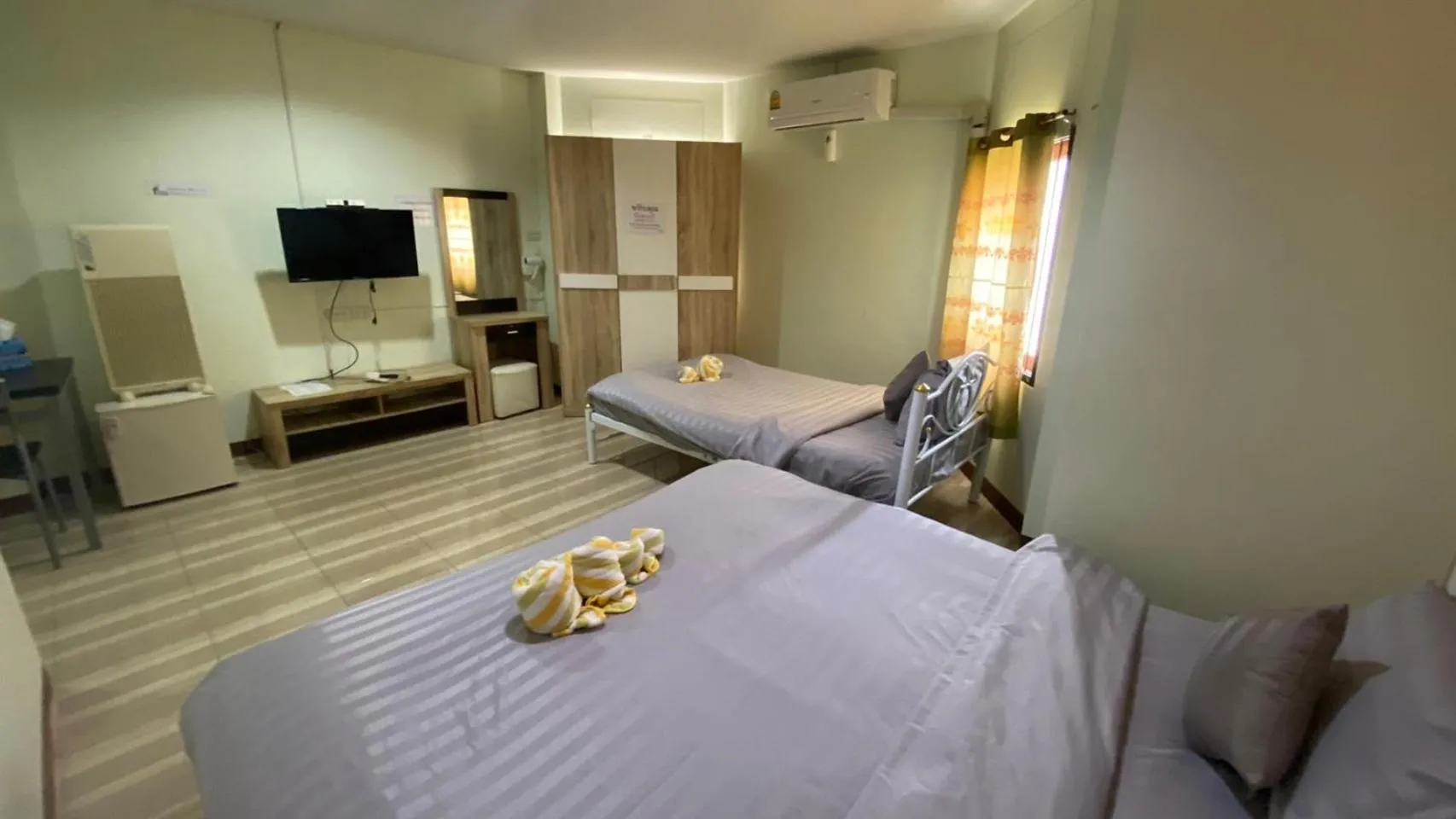 Bed in Alongkorn hotel by SB