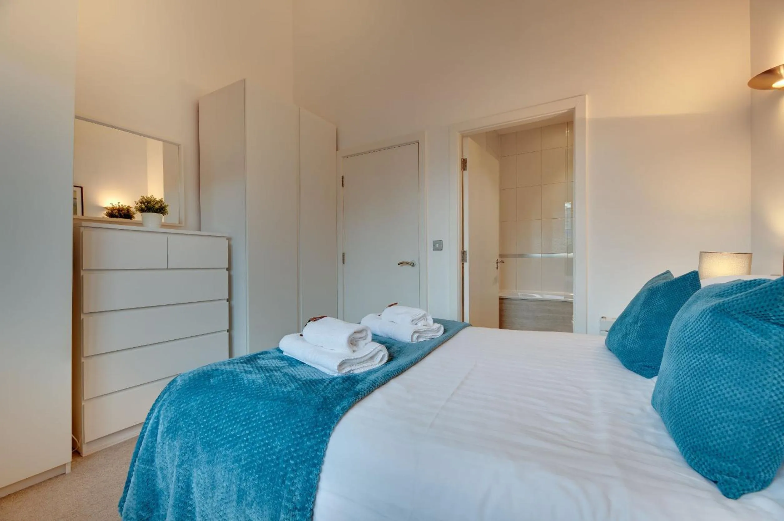 Bed in Crown Apartments 1C by Week2Week