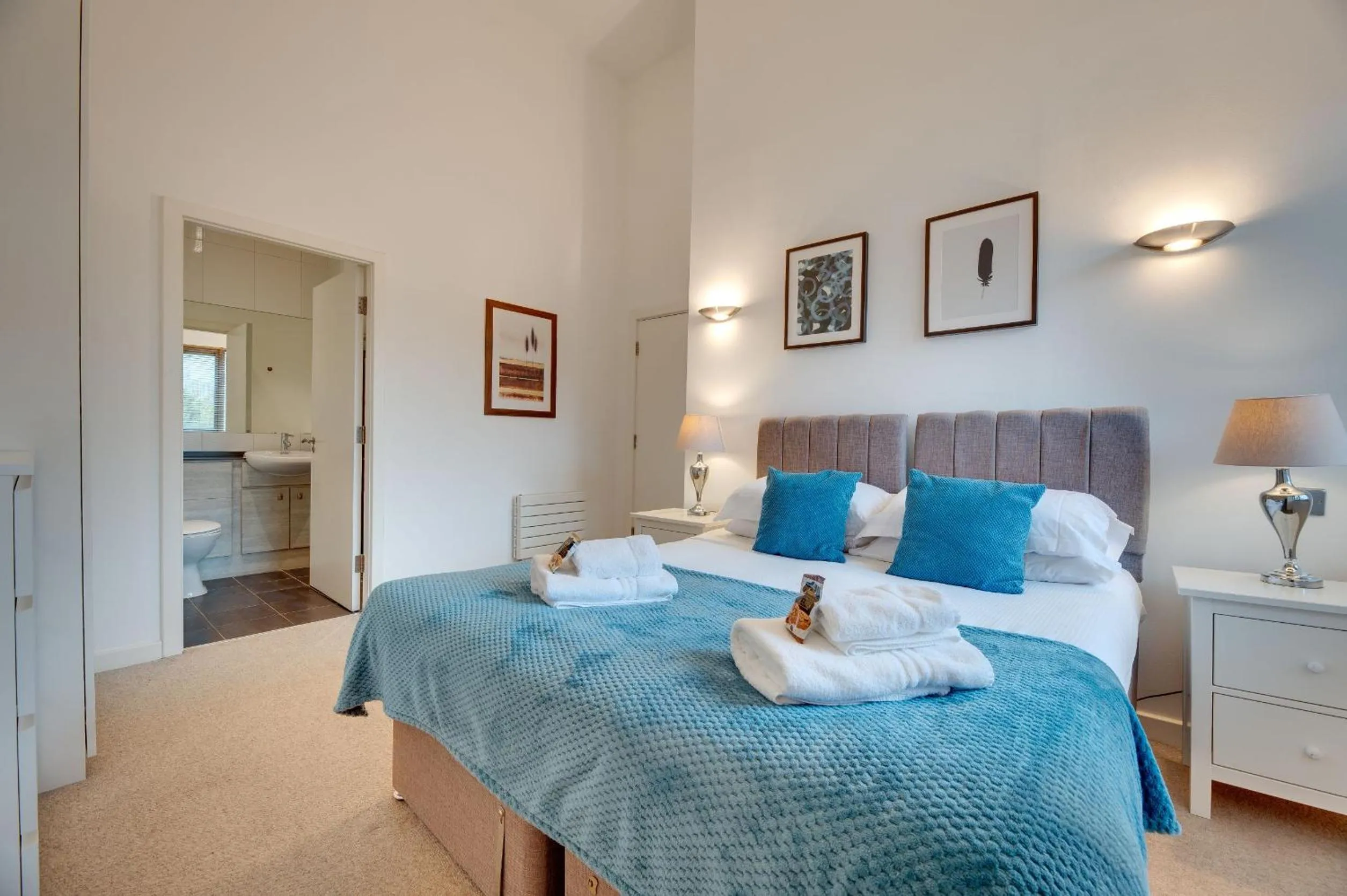 Bed in Crown Apartments 1C by Week2Week