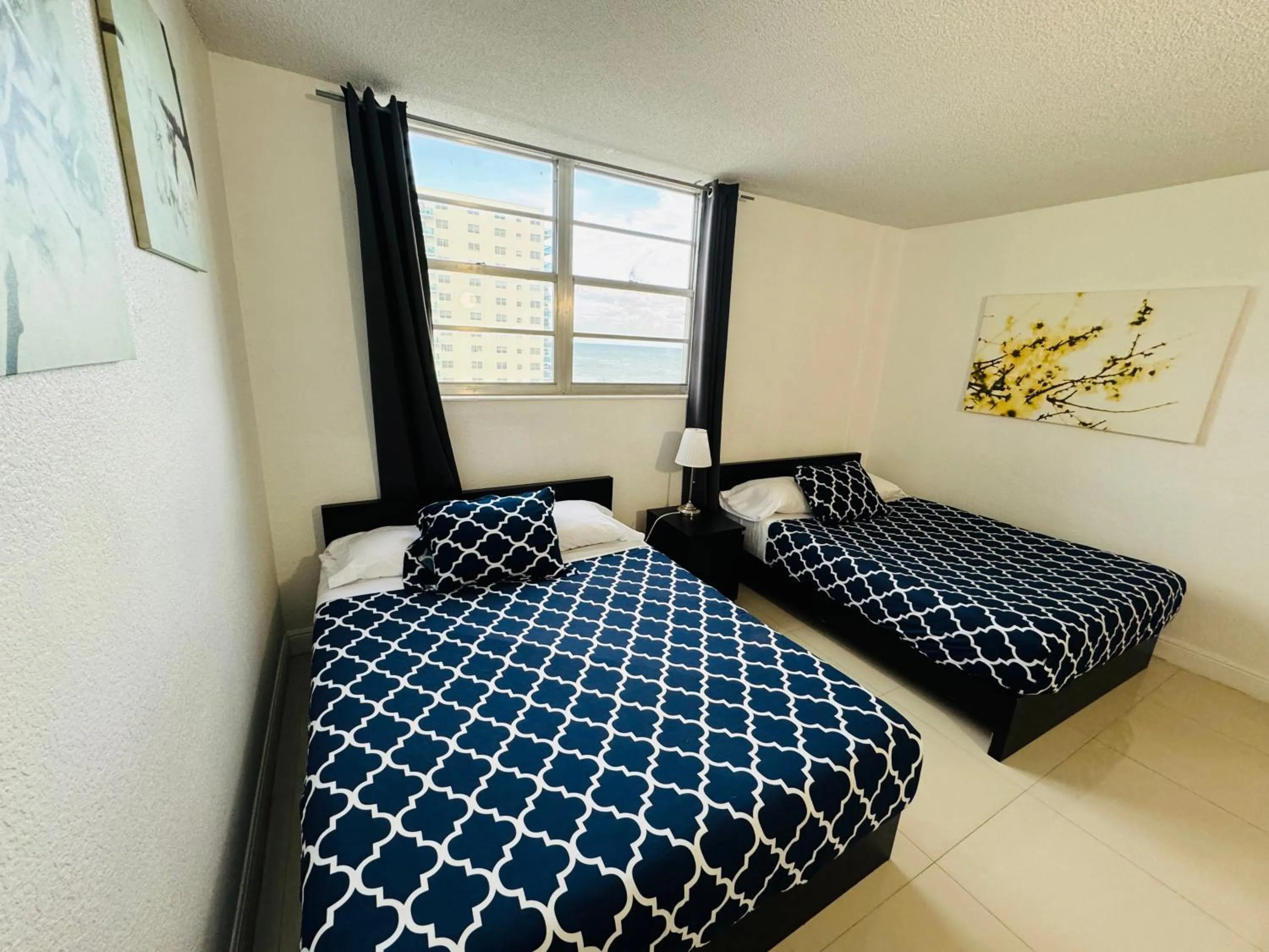 Bed in Miami Hallandale Condo, Partial Ocean View Direct Beach and Pool Access Miami Hollywood Beach