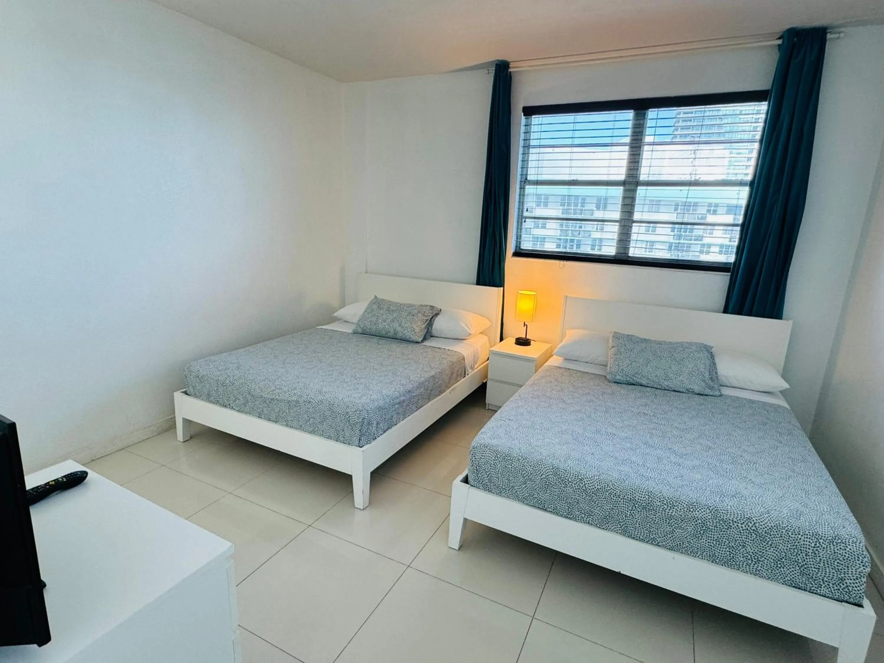 Bed in Miami Hallandale Condo, Partial Ocean View Direct Beach and Pool Access Miami Hollywood Beach