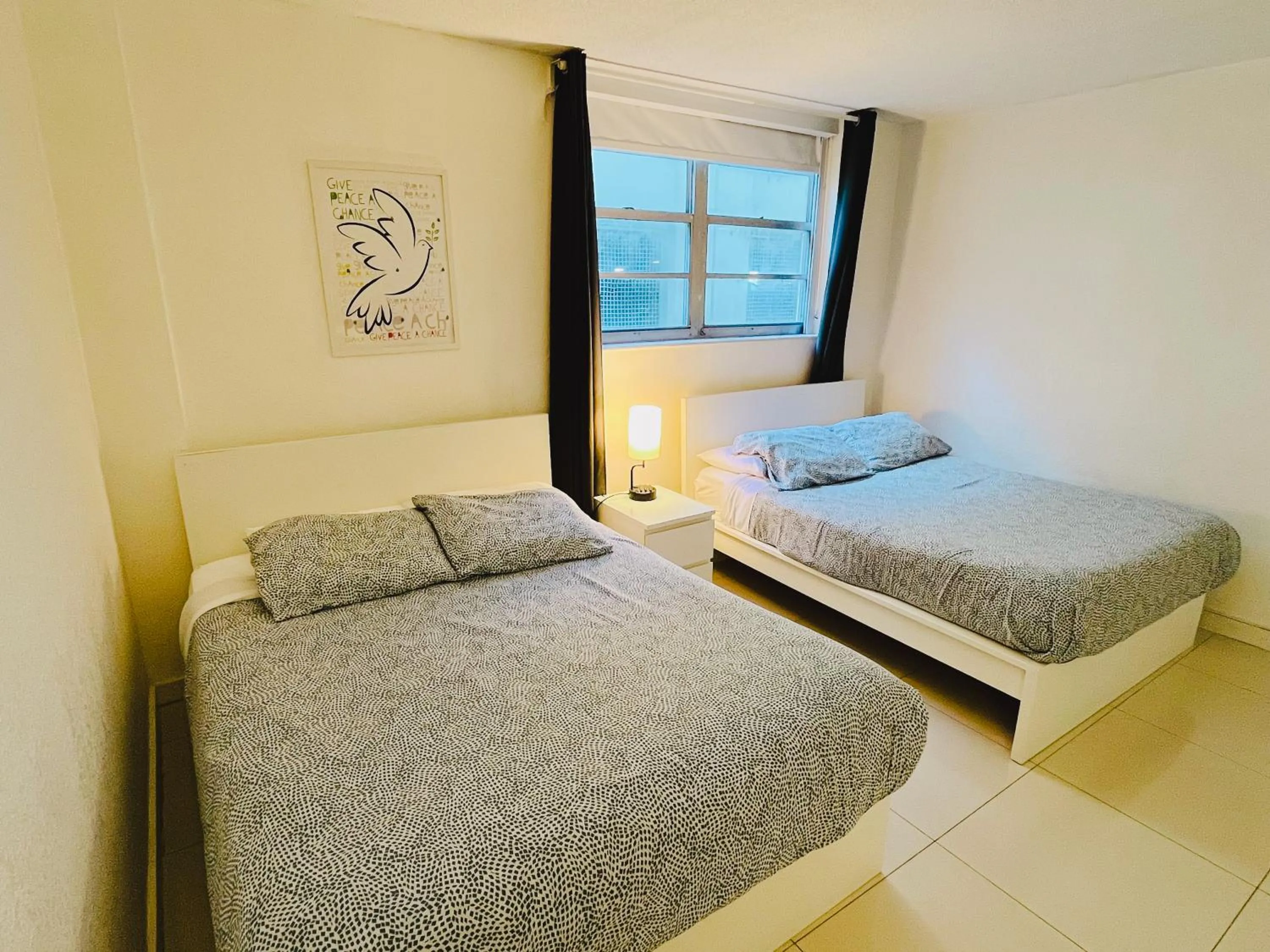 Bed in Miami Hallandale Condo, Partial Ocean View Direct Beach and Pool Access Miami Hollywood Beach