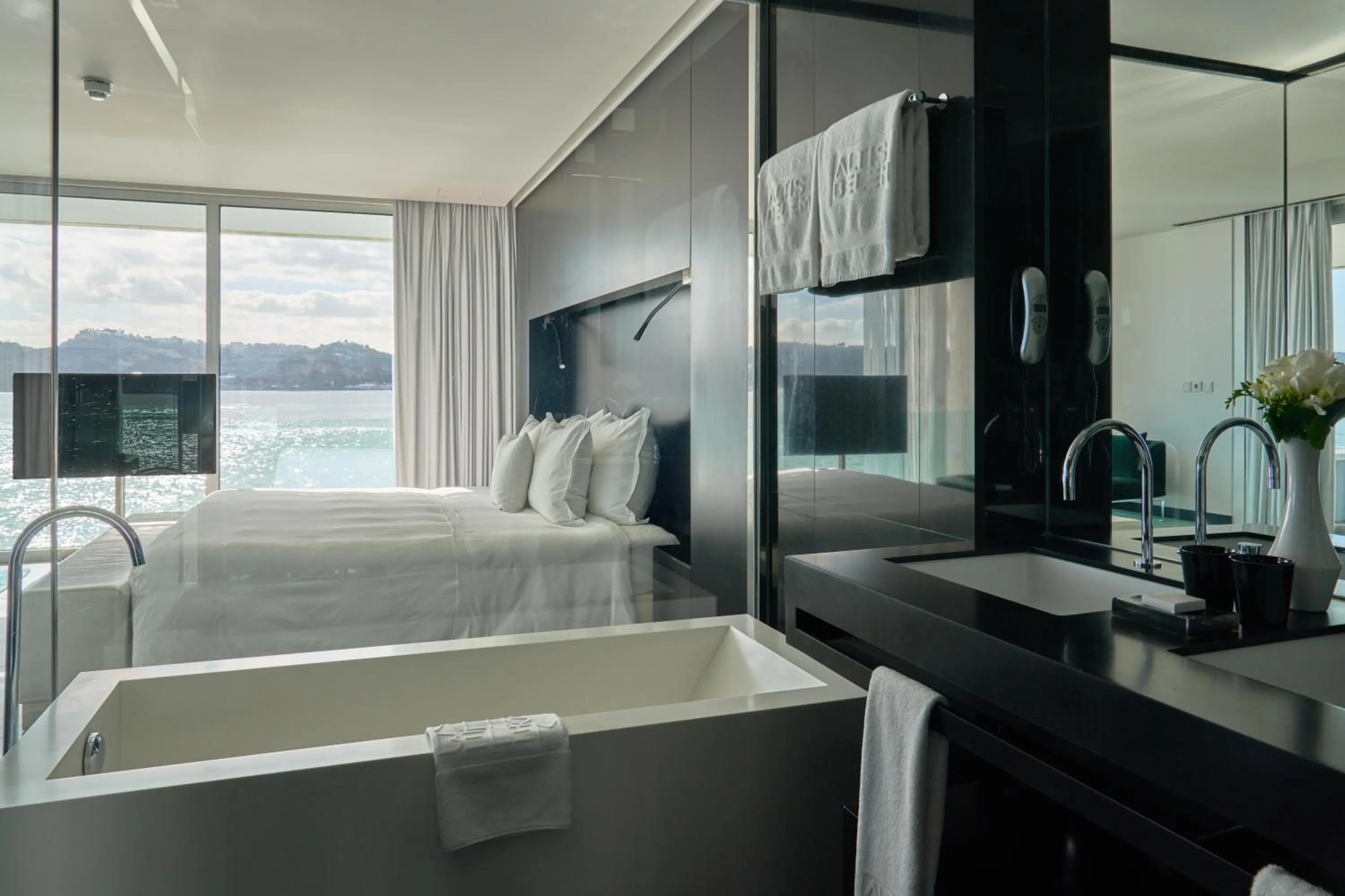 Bathroom, Bed in Altis Belem Hotel & Spa, a Member of Design Hotels