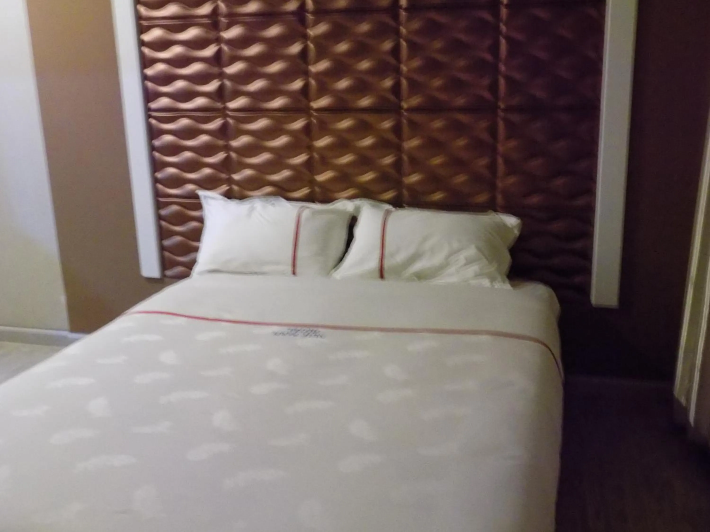 Bedroom in Freedom City Hotel Najjanankumbi Kamapala