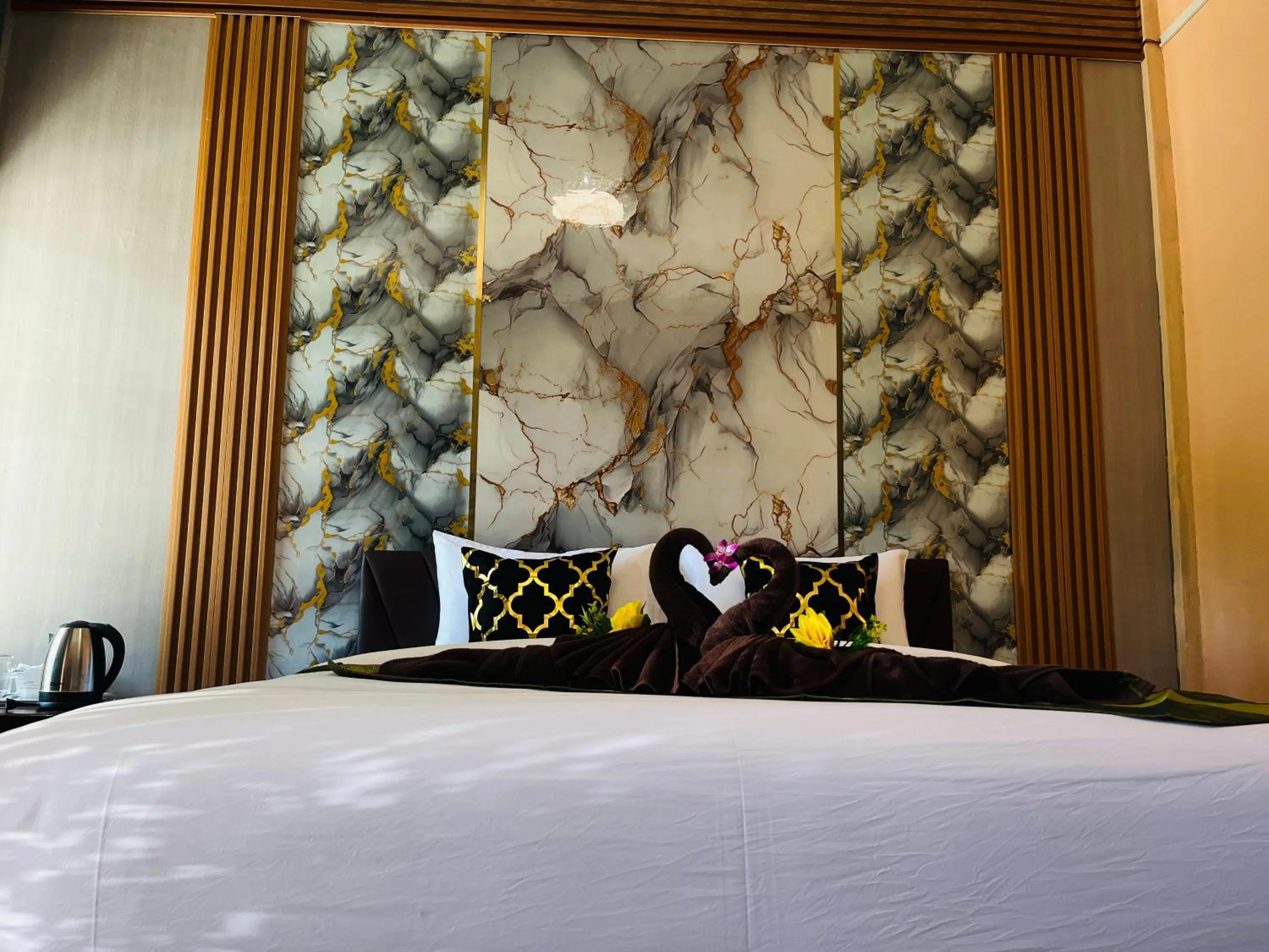 Bed in New Ozone Resort & Spa