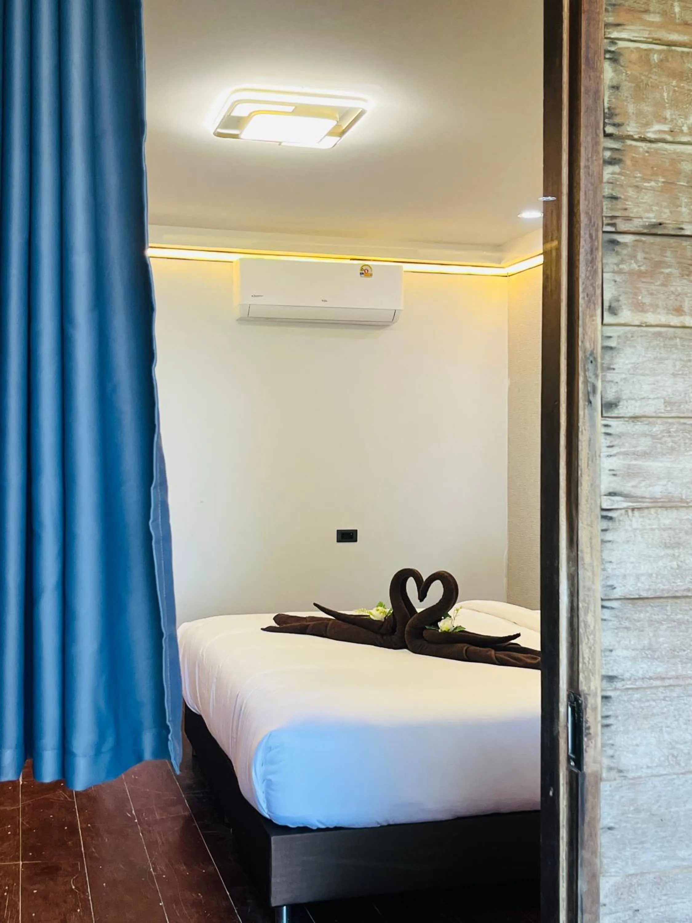 Bed in New Ozone Resort & Spa