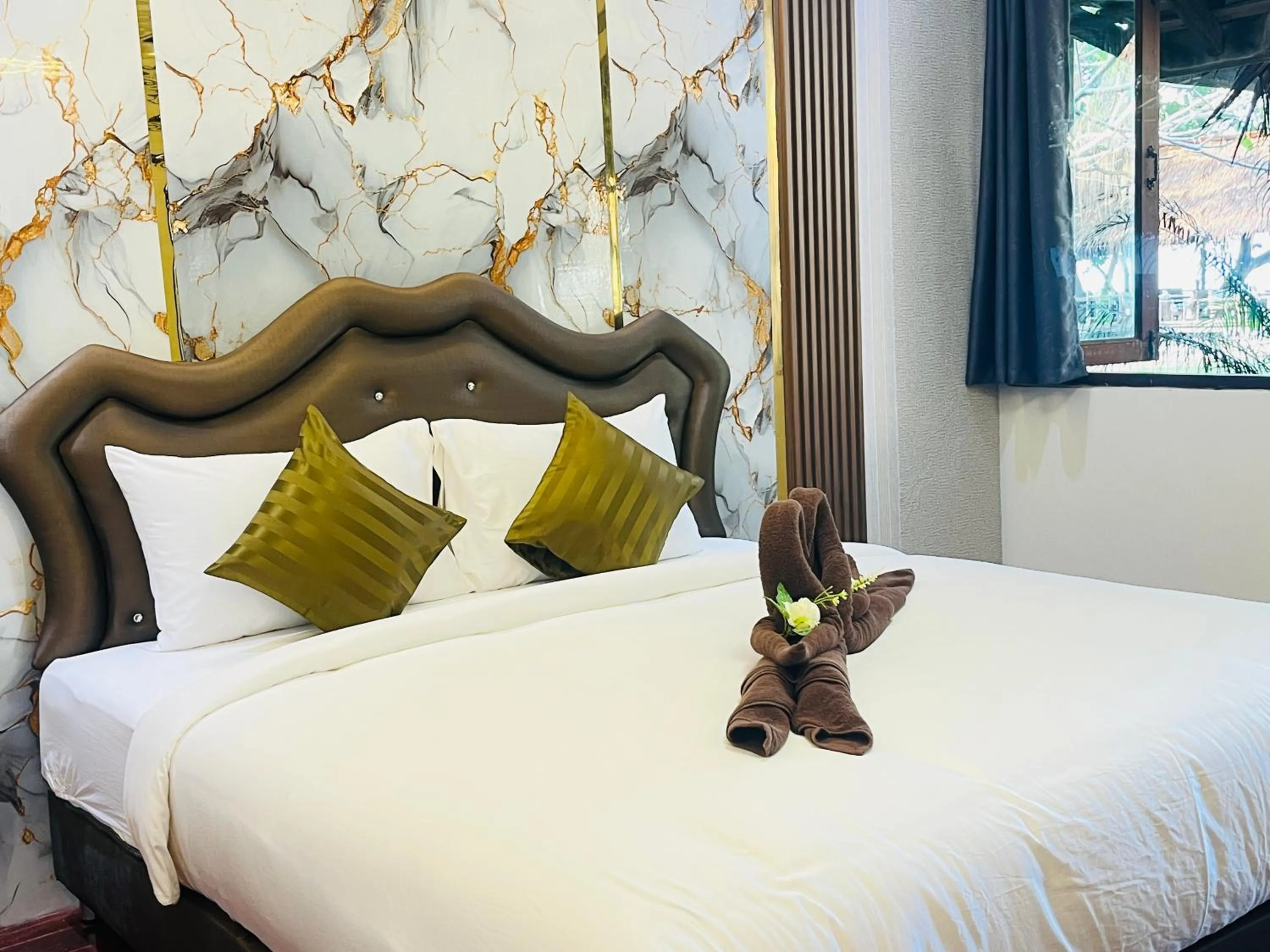 Bed in New Ozone Resort & Spa