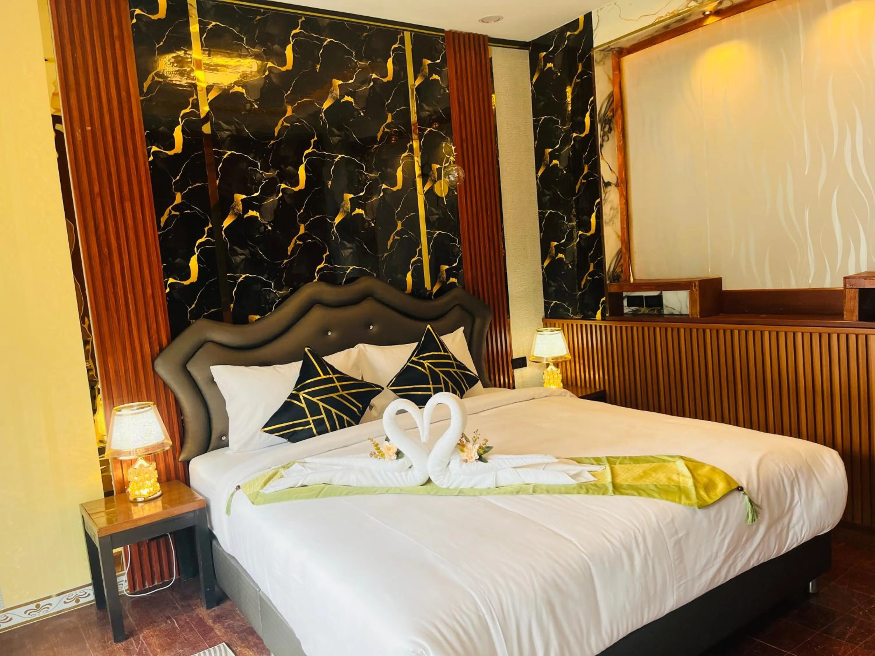 Bed in New Ozone Resort & Spa