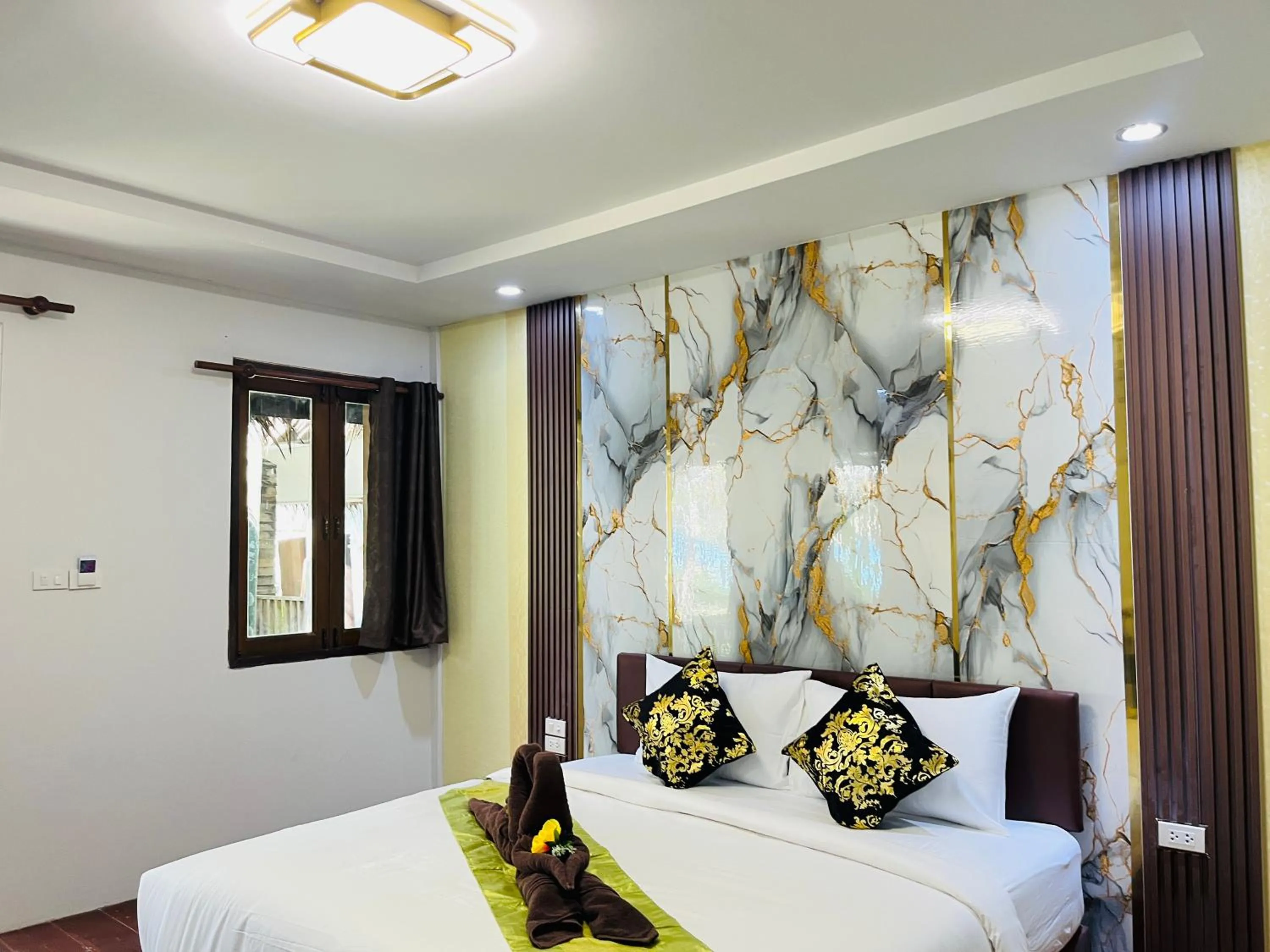 Bed in New Ozone Resort & Spa