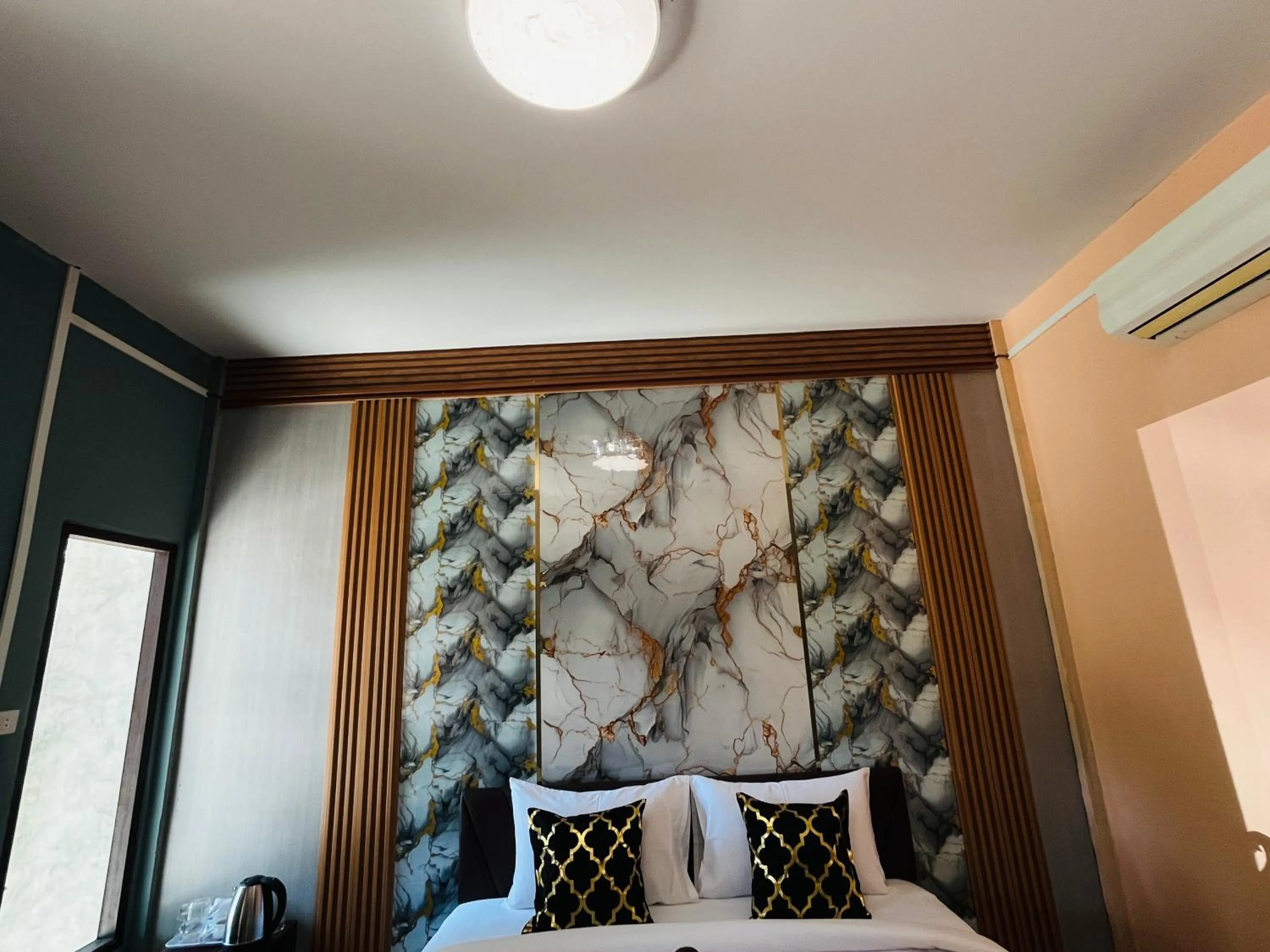 Bed in New Ozone Resort & Spa