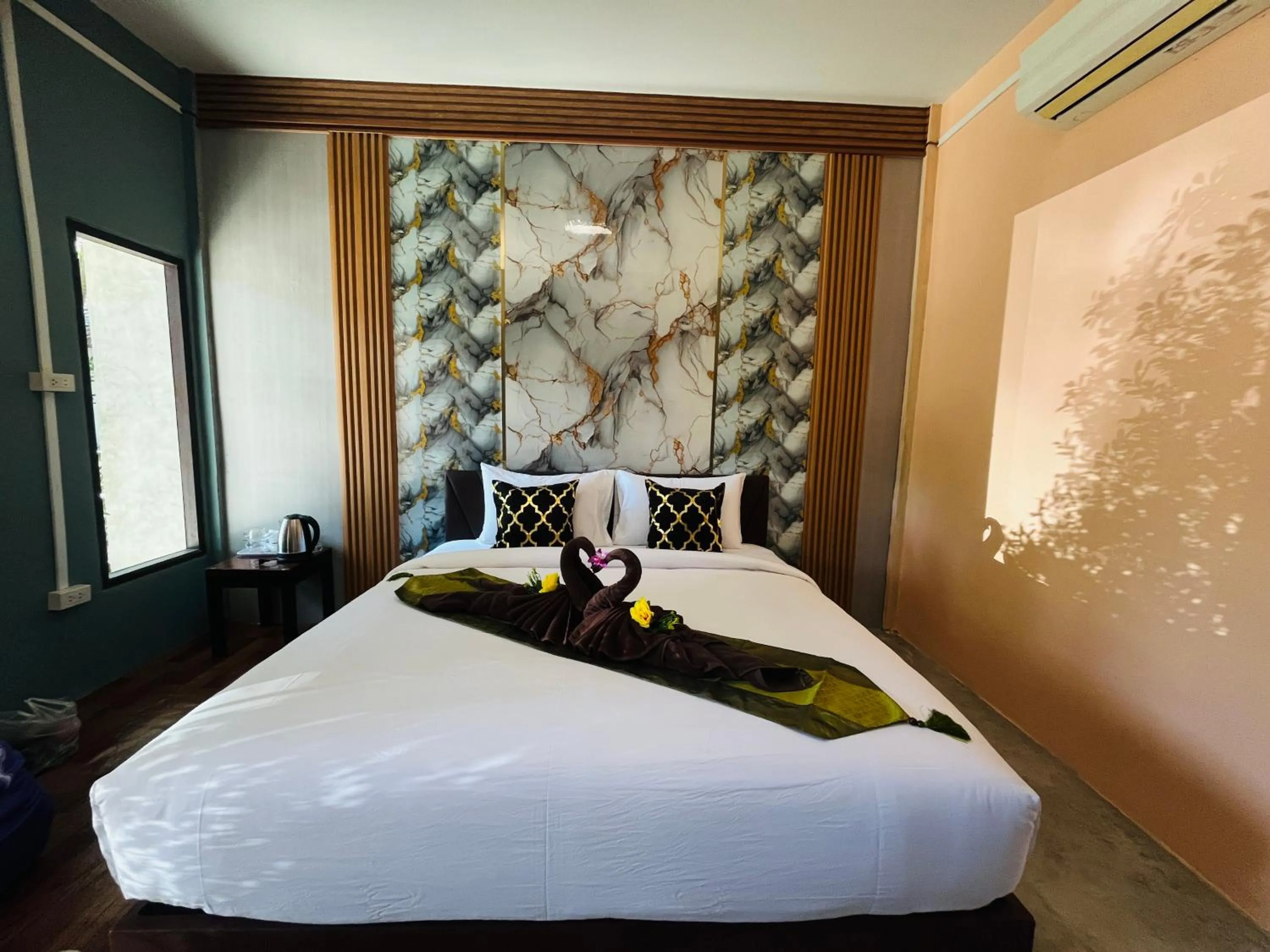 Bed in New Ozone Resort & Spa