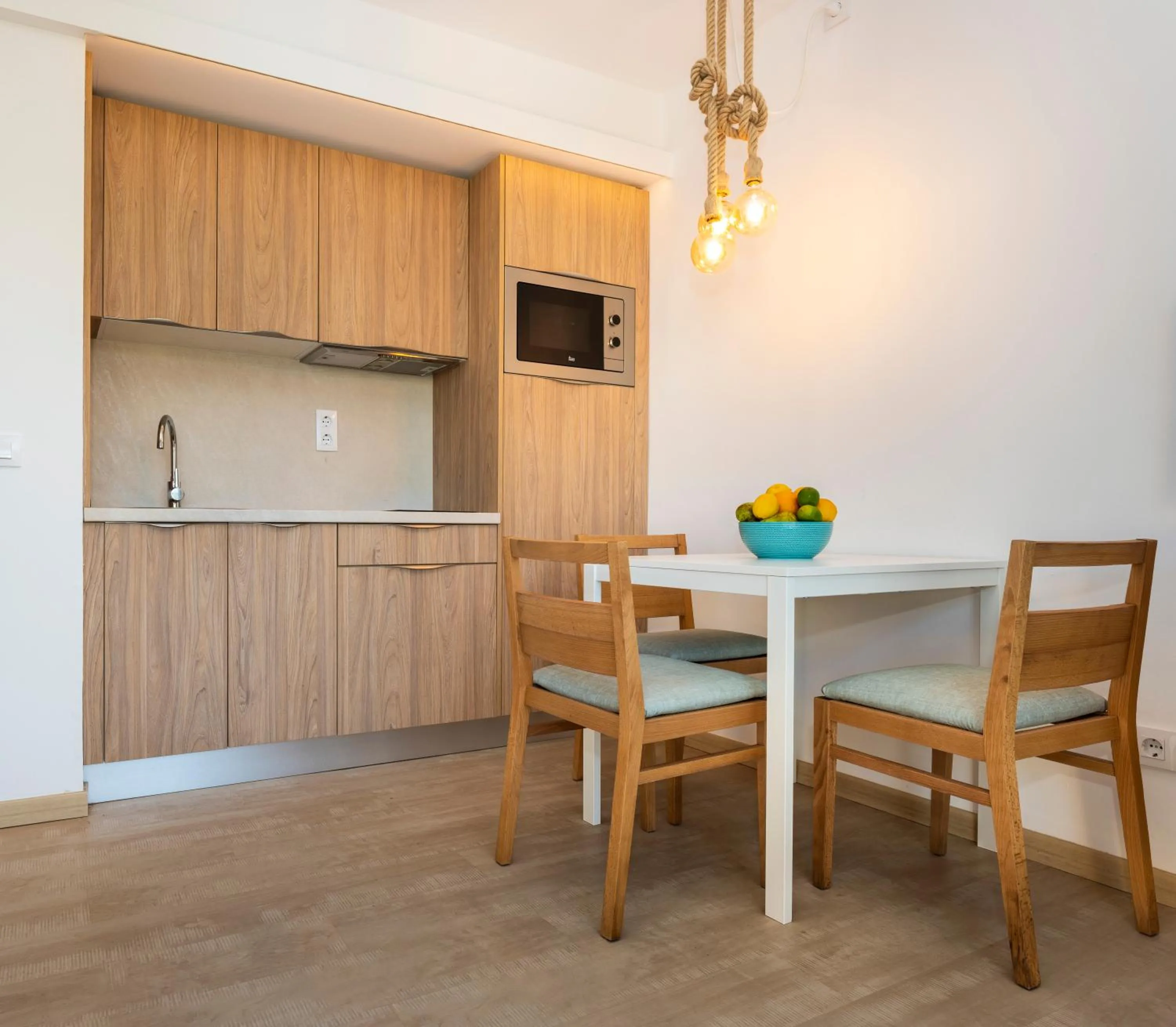 Kitchen or kitchenette in Apartamentos S'Olivera