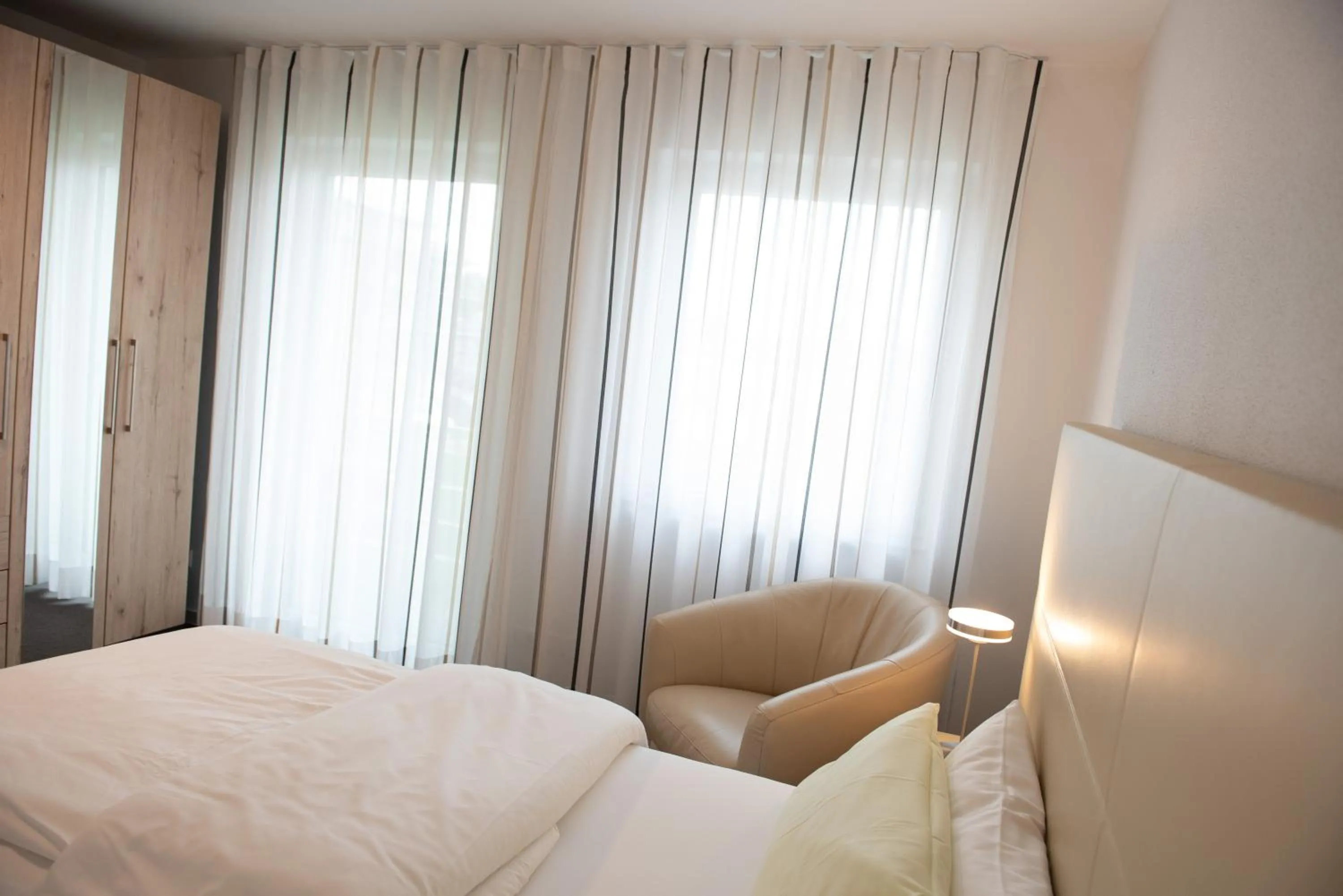 Bed in Apartments Amtzell, Selbst-Check-in